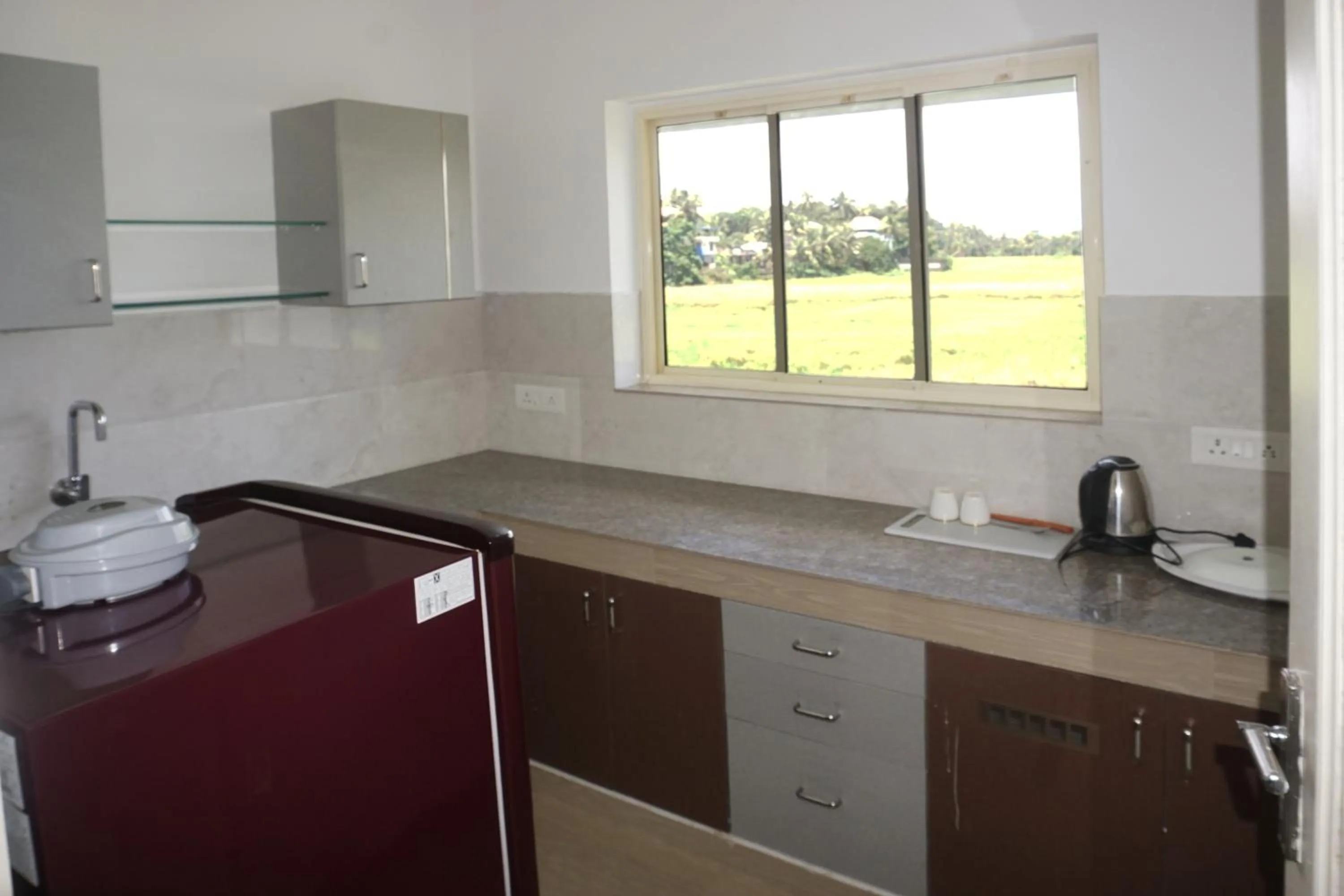 Kitchen or kitchenette in Hisham Residency
