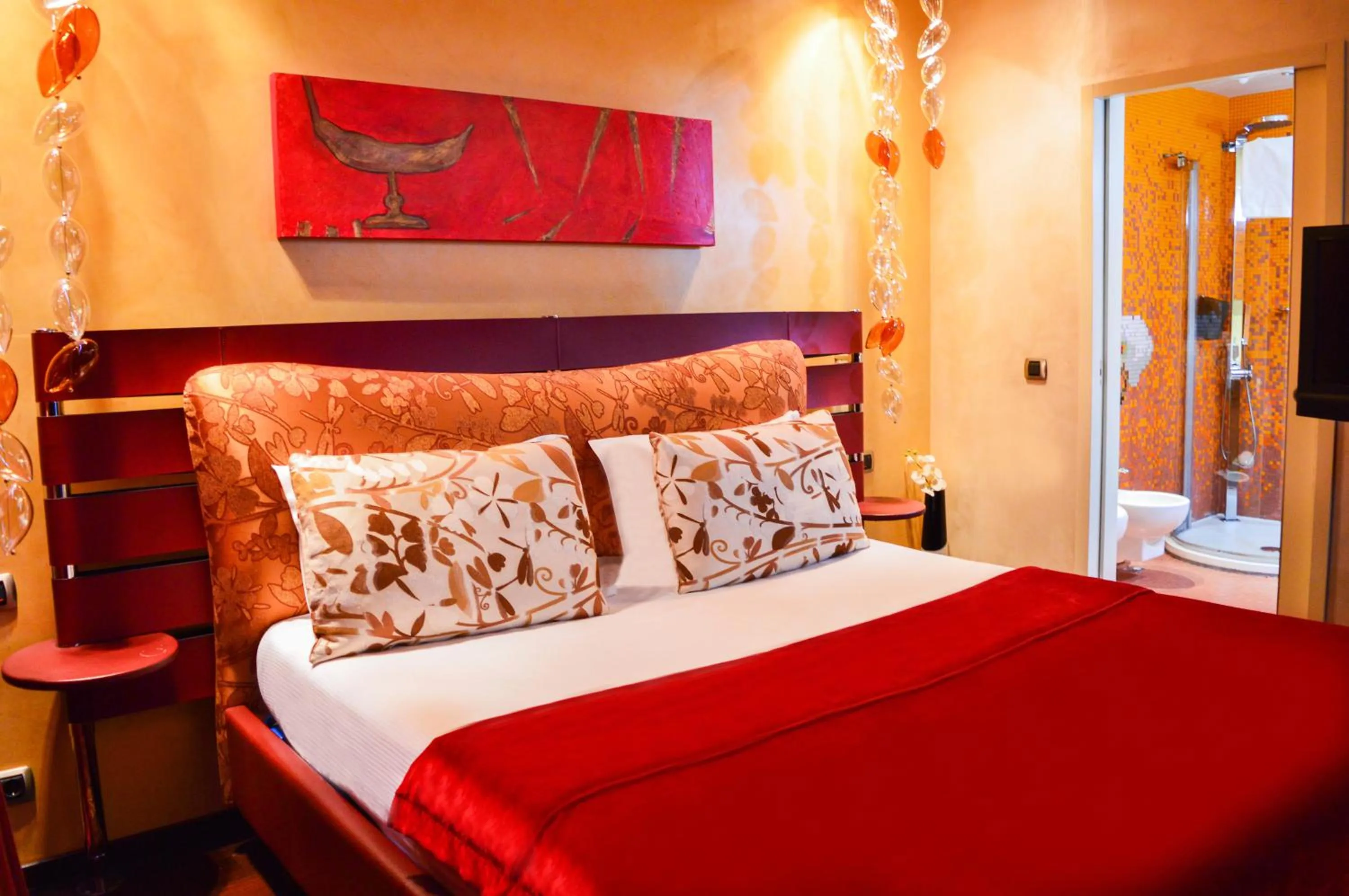 Bed in Les Fleurs Boutique Hotel