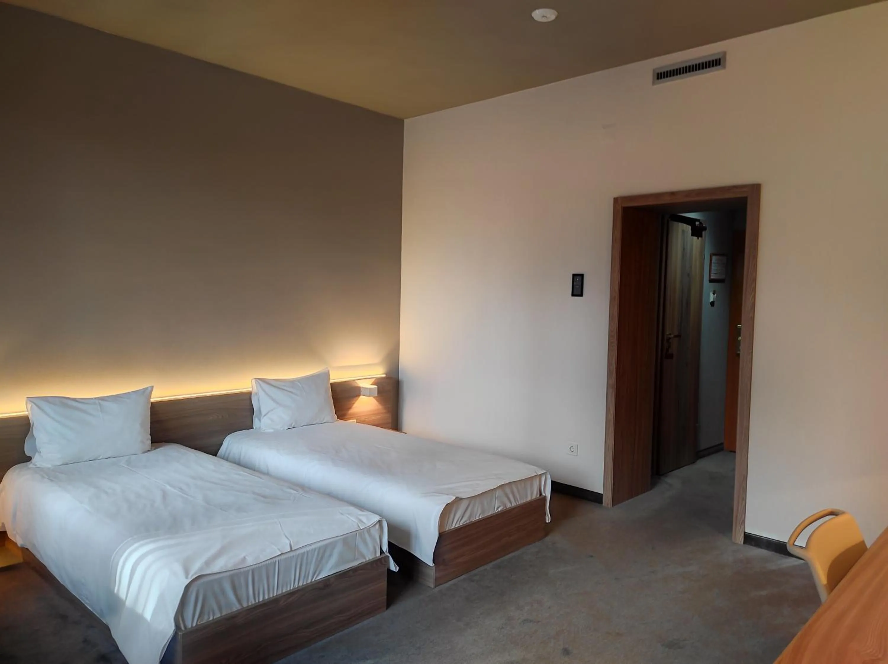 Bed in Jolly Alon Hotel & Business Center