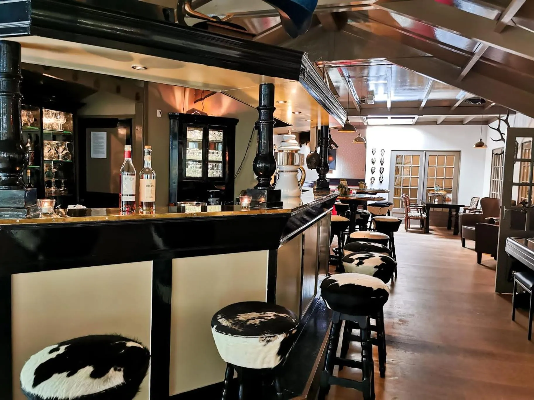 Communal lounge/ TV room in Landgoedhotel Villa Vennendal