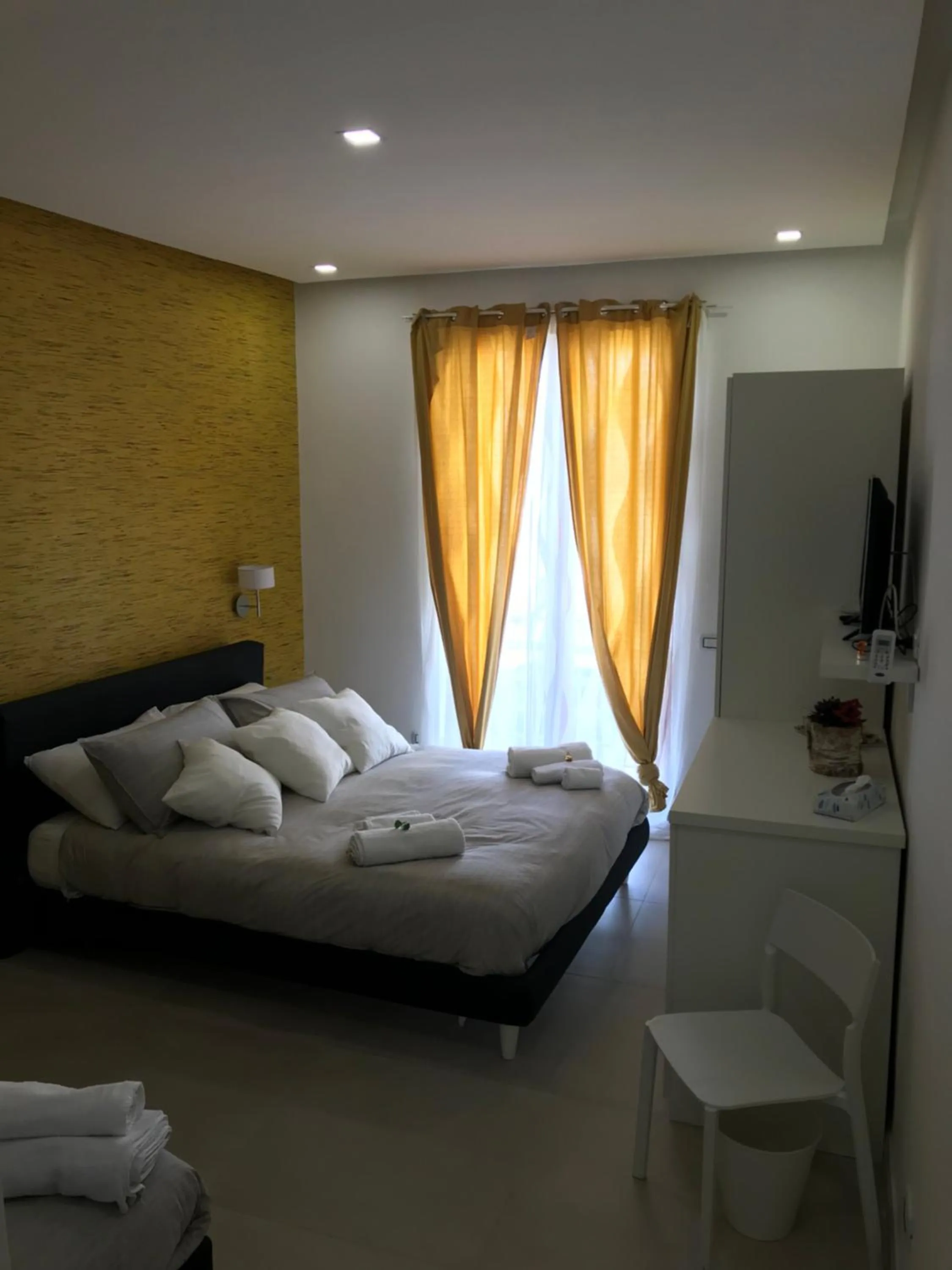 Bed in Terrazza Aragon Room and SPA