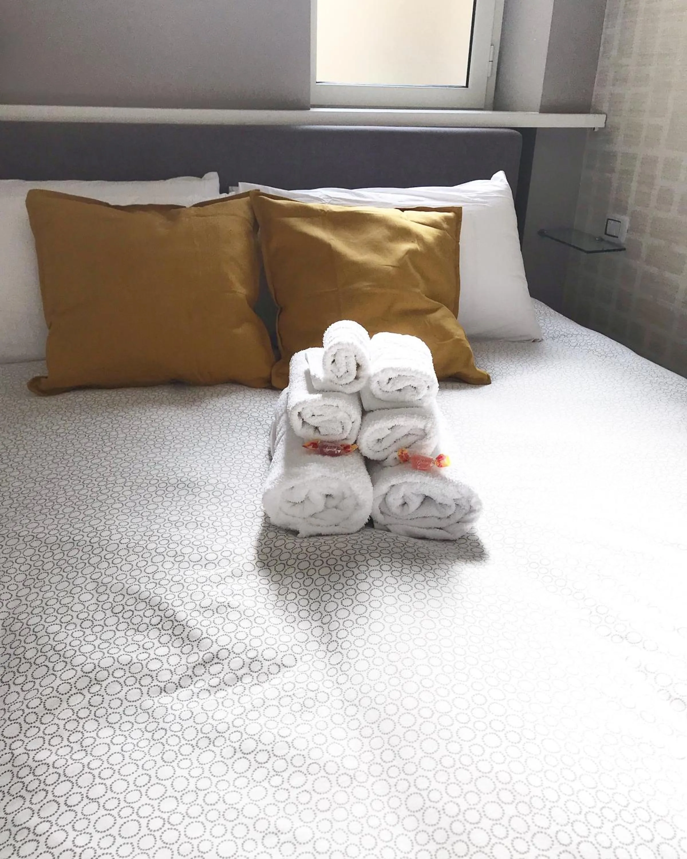 Bed in Terrazza Aragon Room and SPA