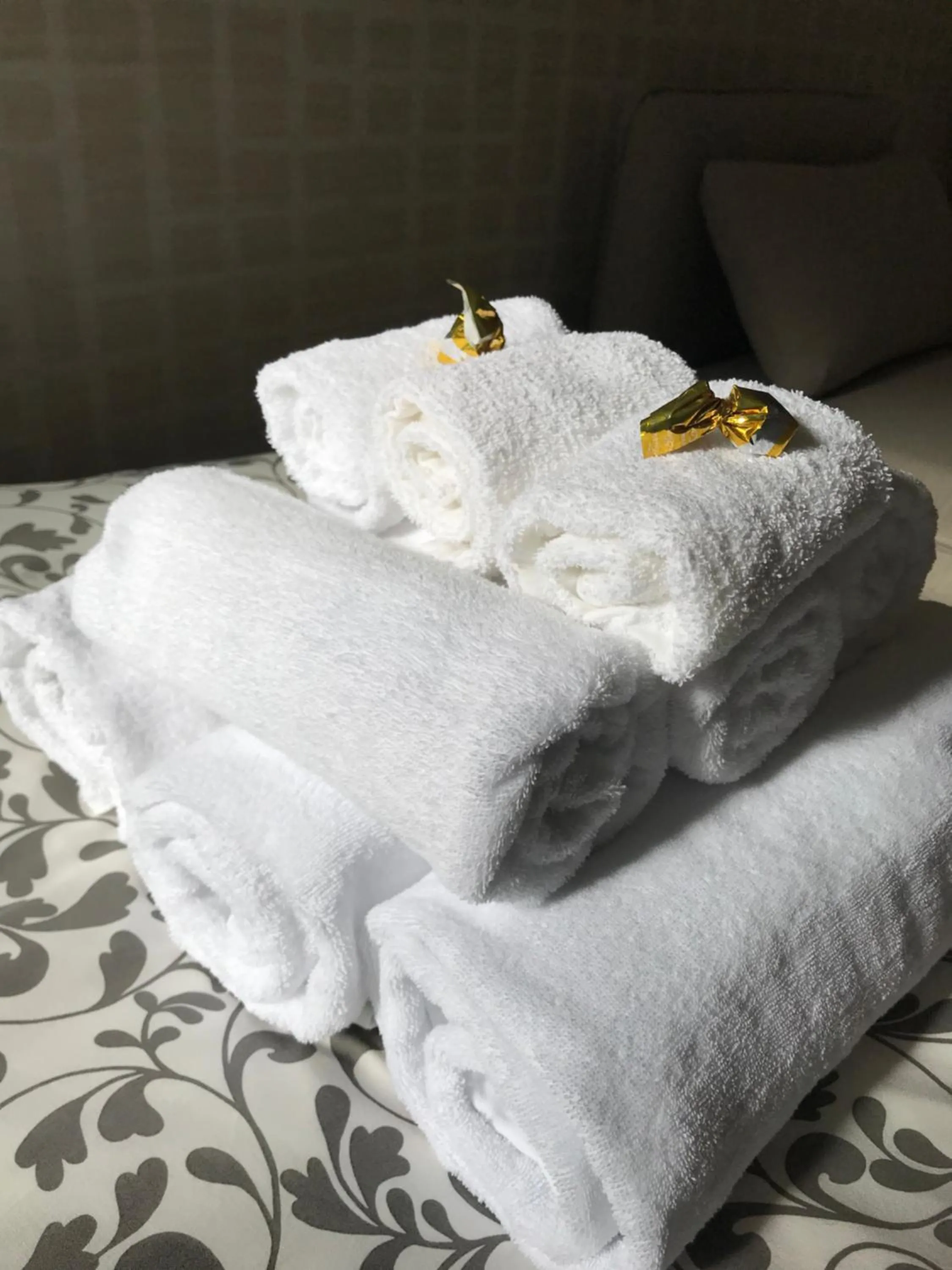 towels, Bed in Terrazza Aragon Room and SPA