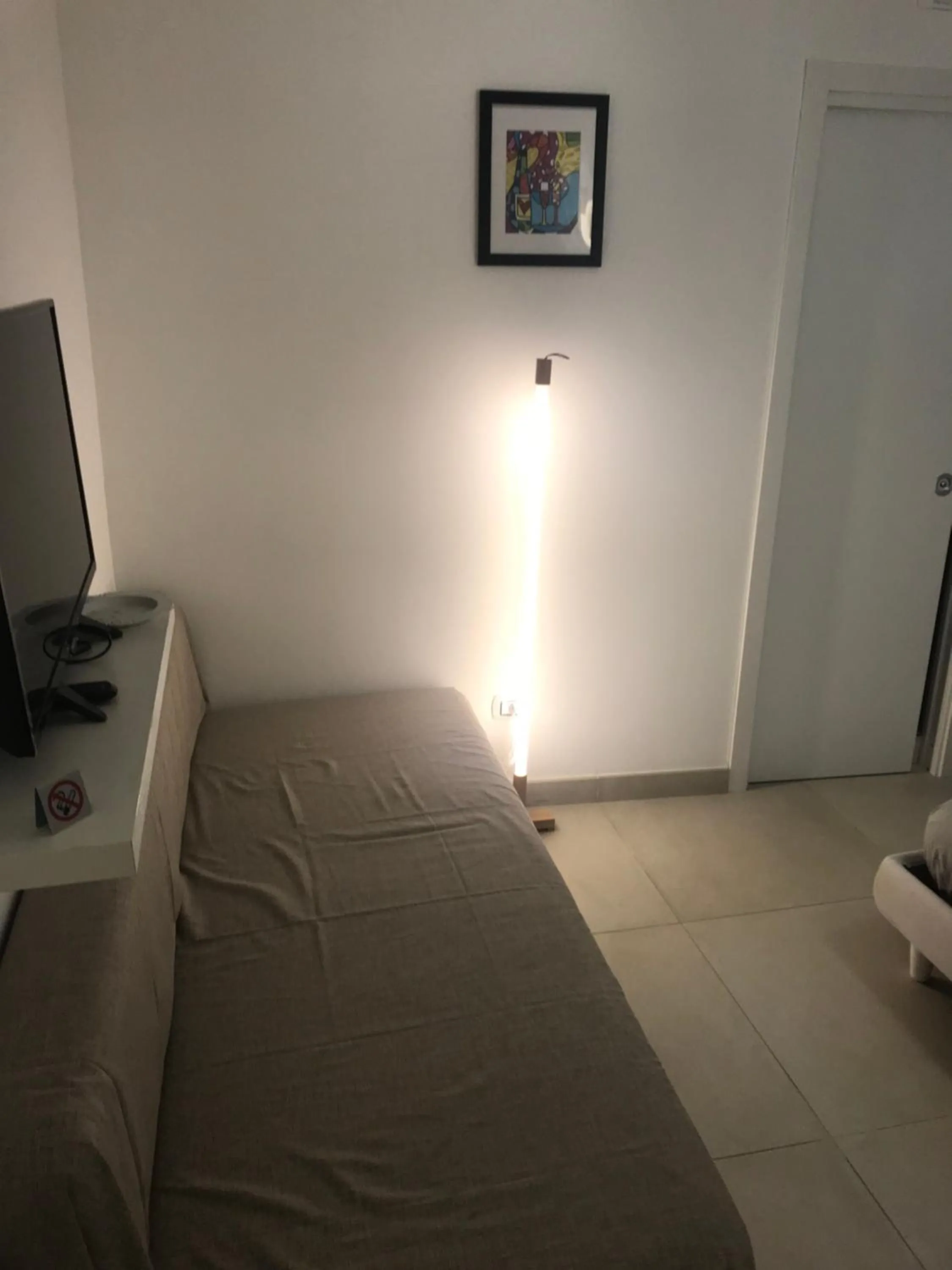 Bed in Terrazza Aragon Room and SPA