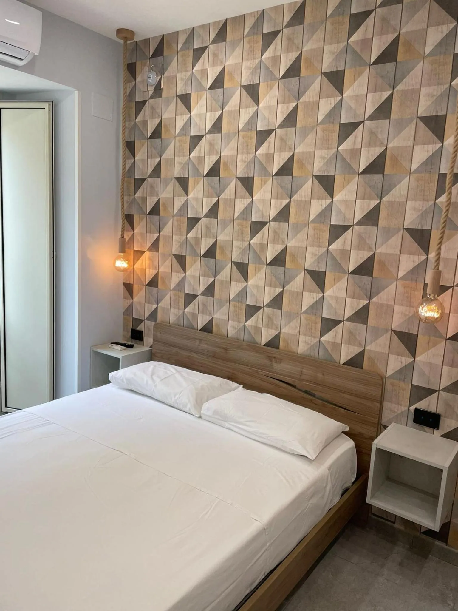 Bed in Terrazza Aragon Room and SPA