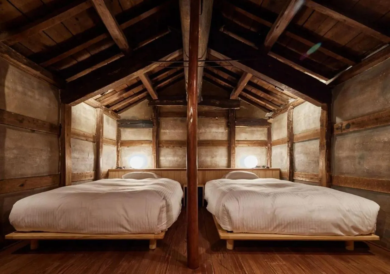 Bed in NIPPONIA Sawara Merchant Town Hotel