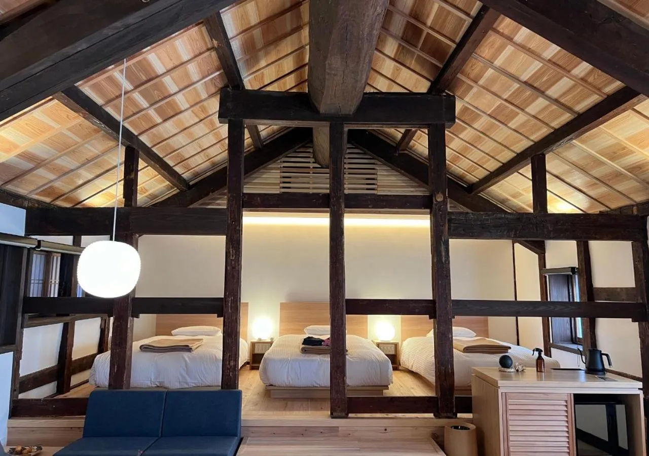 Bed in NIPPONIA Sawara Merchant Town Hotel