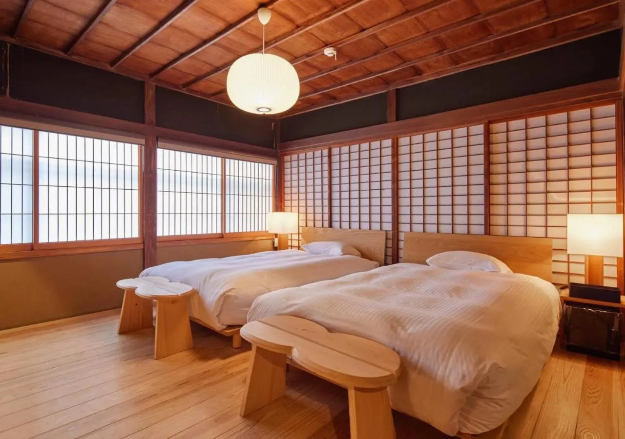 Bed in NIPPONIA Sawara Merchant Town Hotel