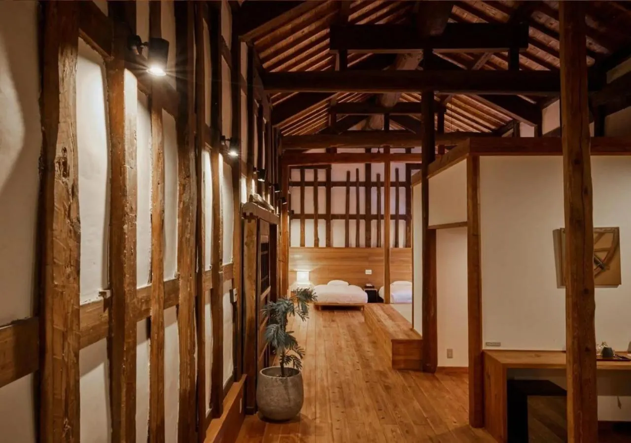 Bed in NIPPONIA Sawara Merchant Town Hotel