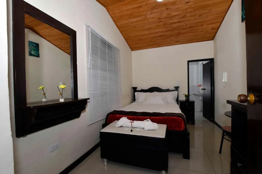 Photo of the whole room, Bed in Hotel Aroma del Bosque Posada Cafe