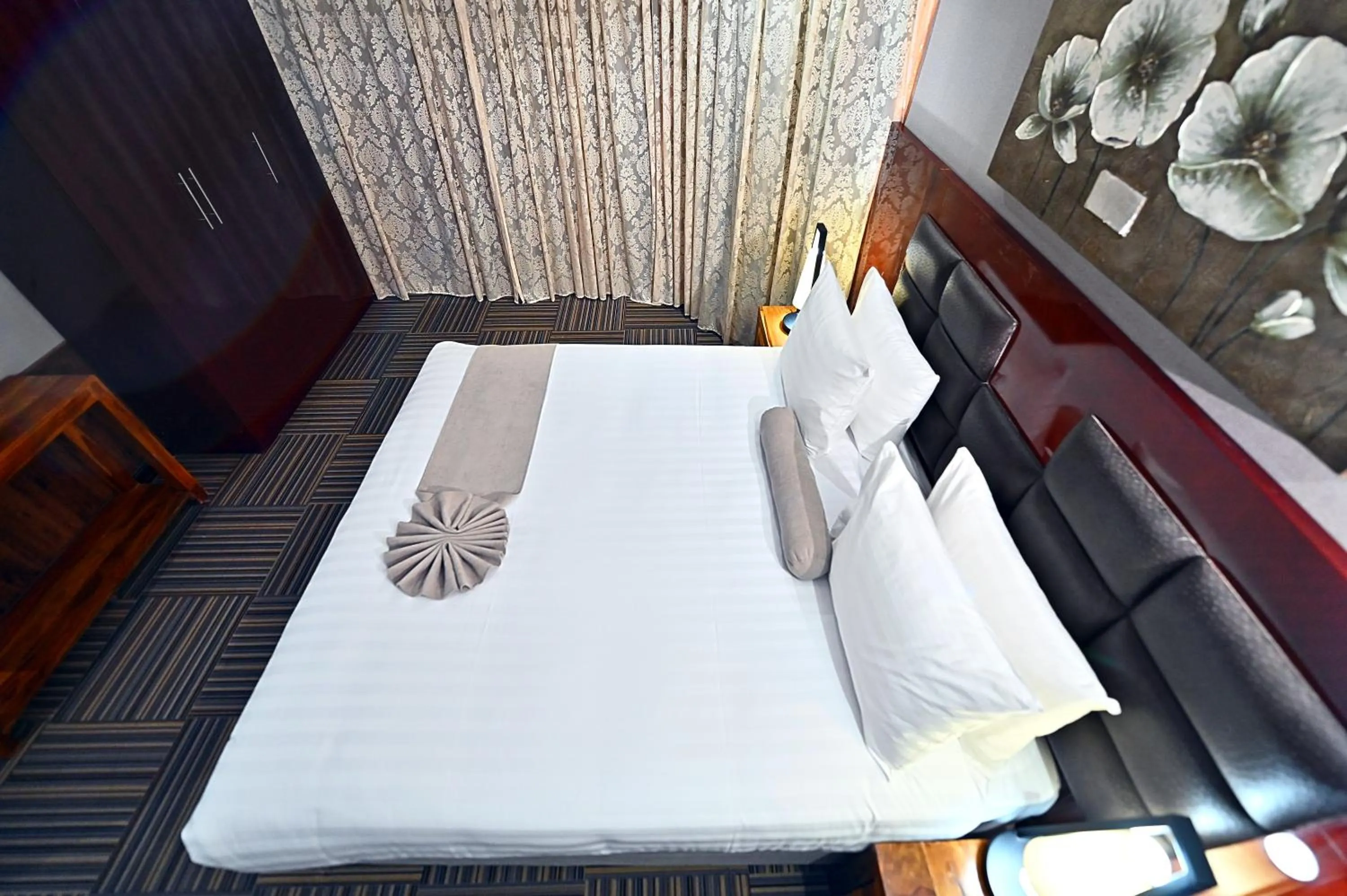 Bed in Ewan Ajman Suites Hotel