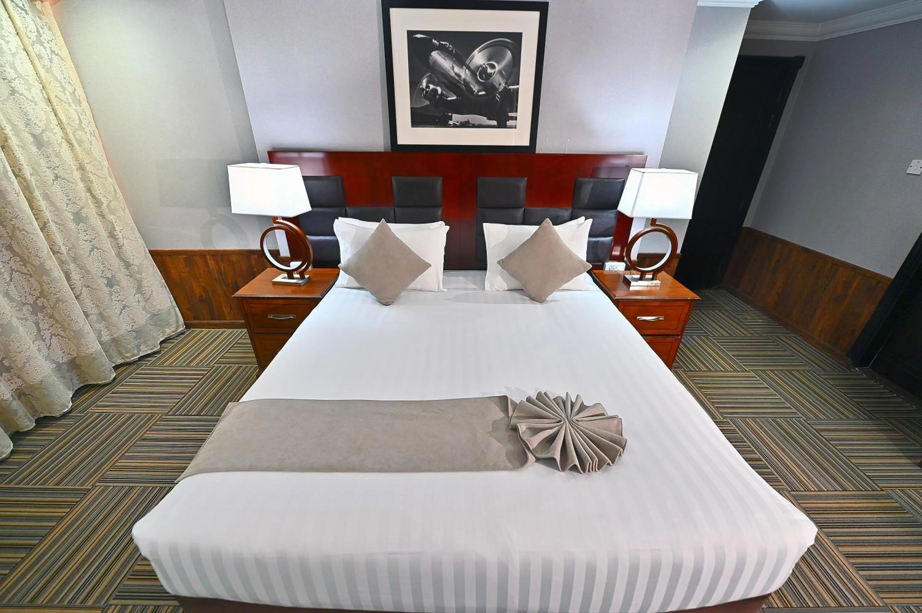Bed in Ewan Ajman Suites Hotel
