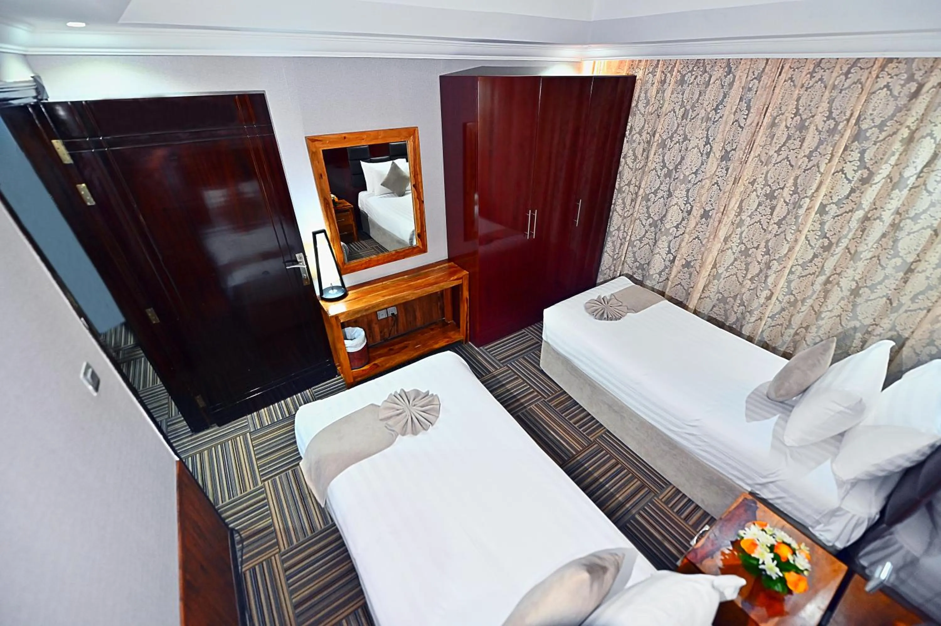 Bed in Ewan Ajman Suites Hotel