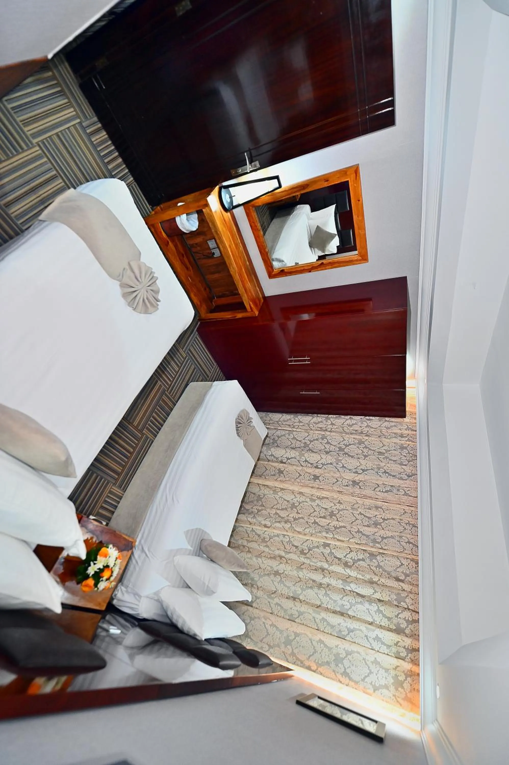 Bed in Ewan Ajman Suites Hotel