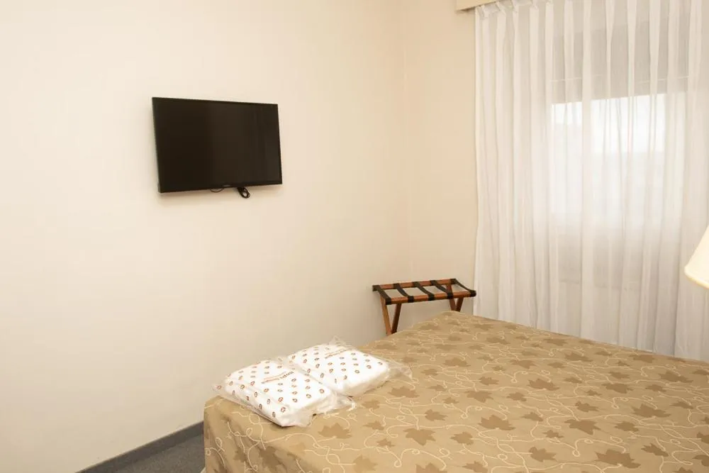 Bedroom, Bed in Comodoro Hotel