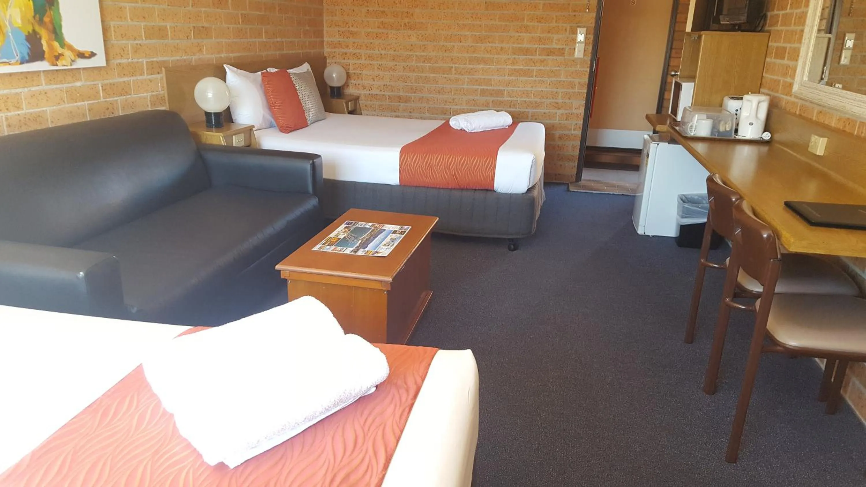 Bed in Royal Palms Motor Inn