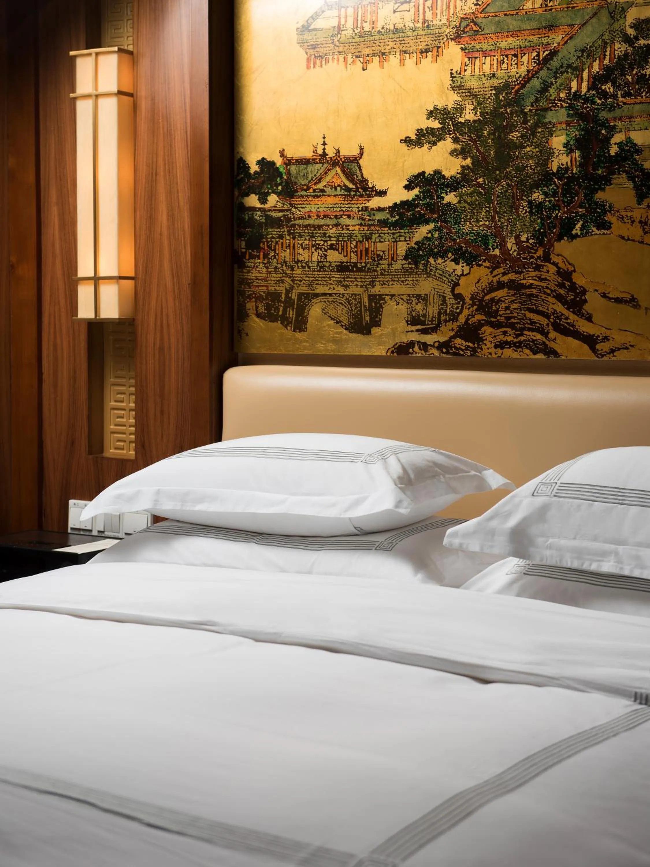 Bed in Zhejiang Xizi Hotel