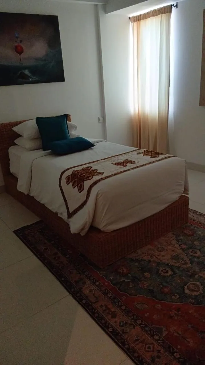 Bed in Kupu Kupu Jimbaran Beach Hotel & Spa by L’Occitane