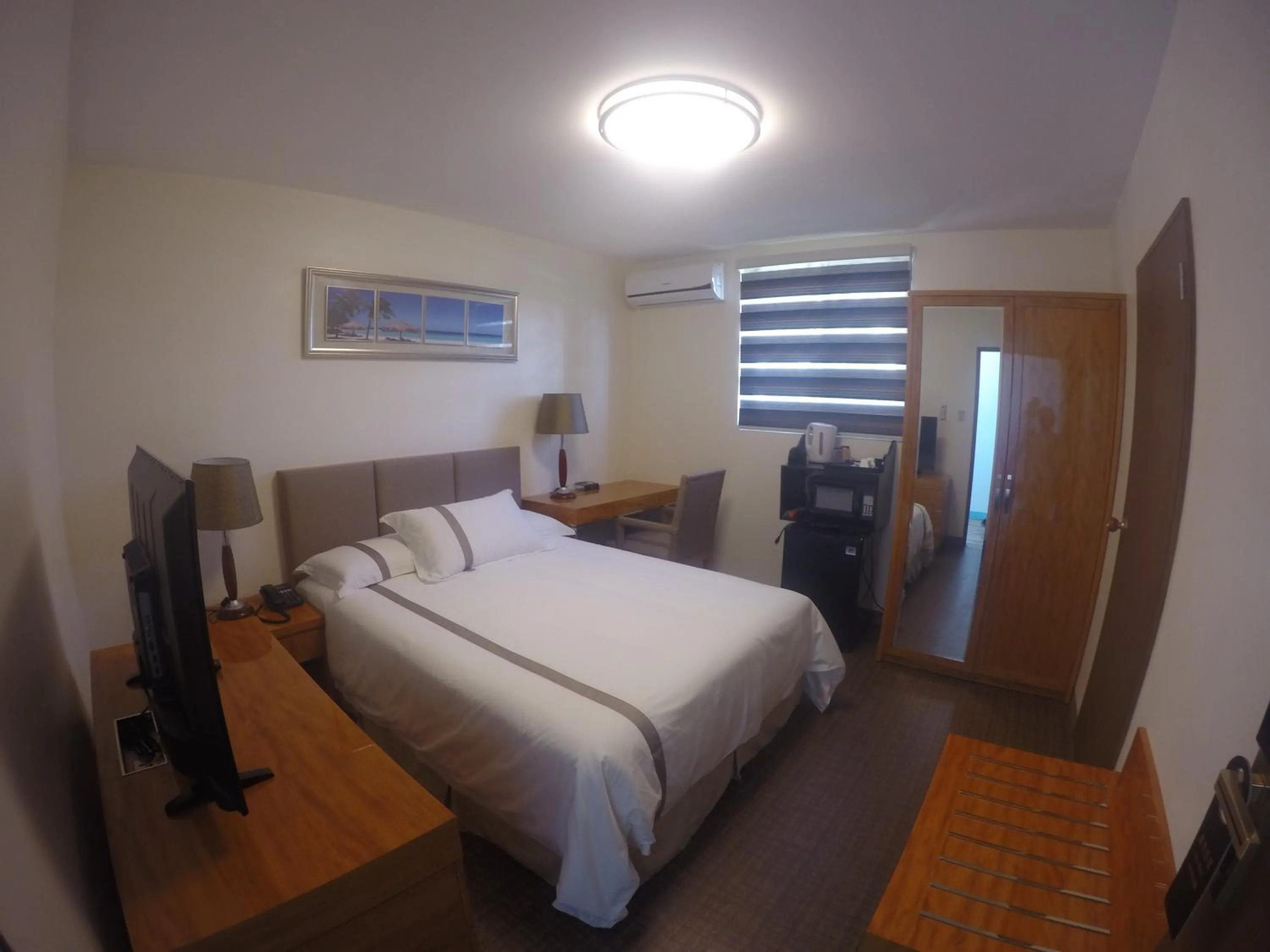 Photo of the whole room, Bed in Saipan Beach Hotel