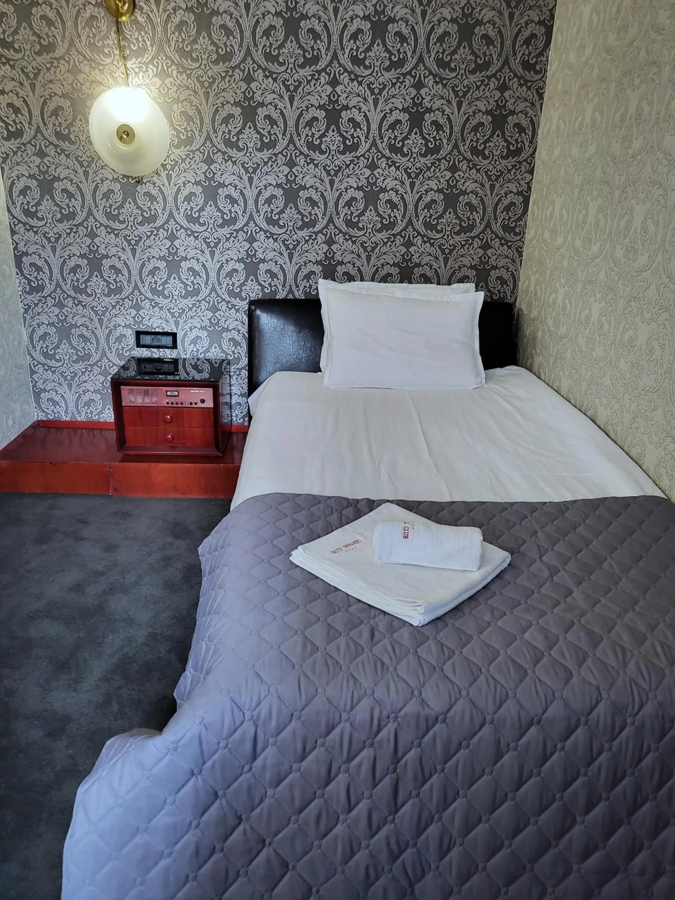 Bed in Gloria Palace Hotel