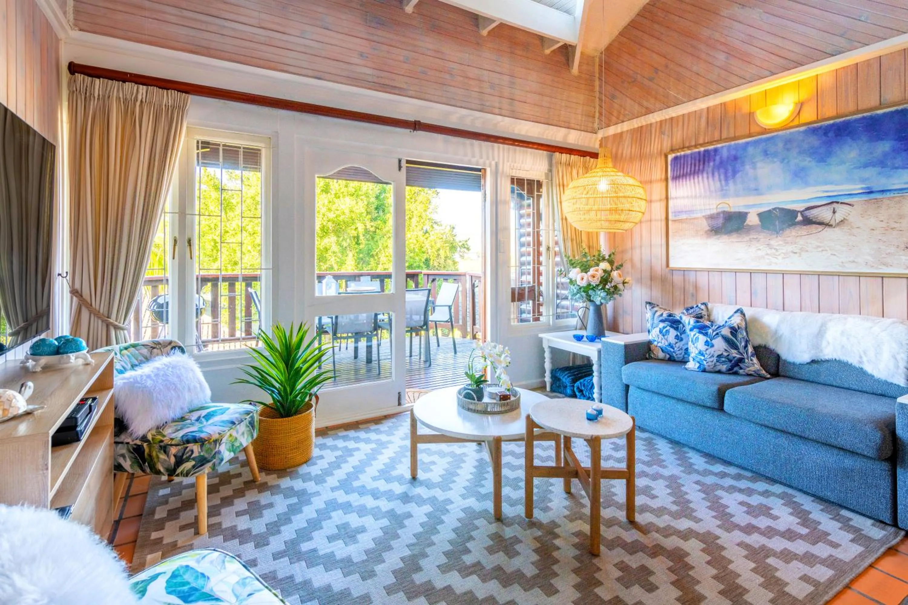 Communal lounge/ TV room in Knysna River Club by First Private Stays