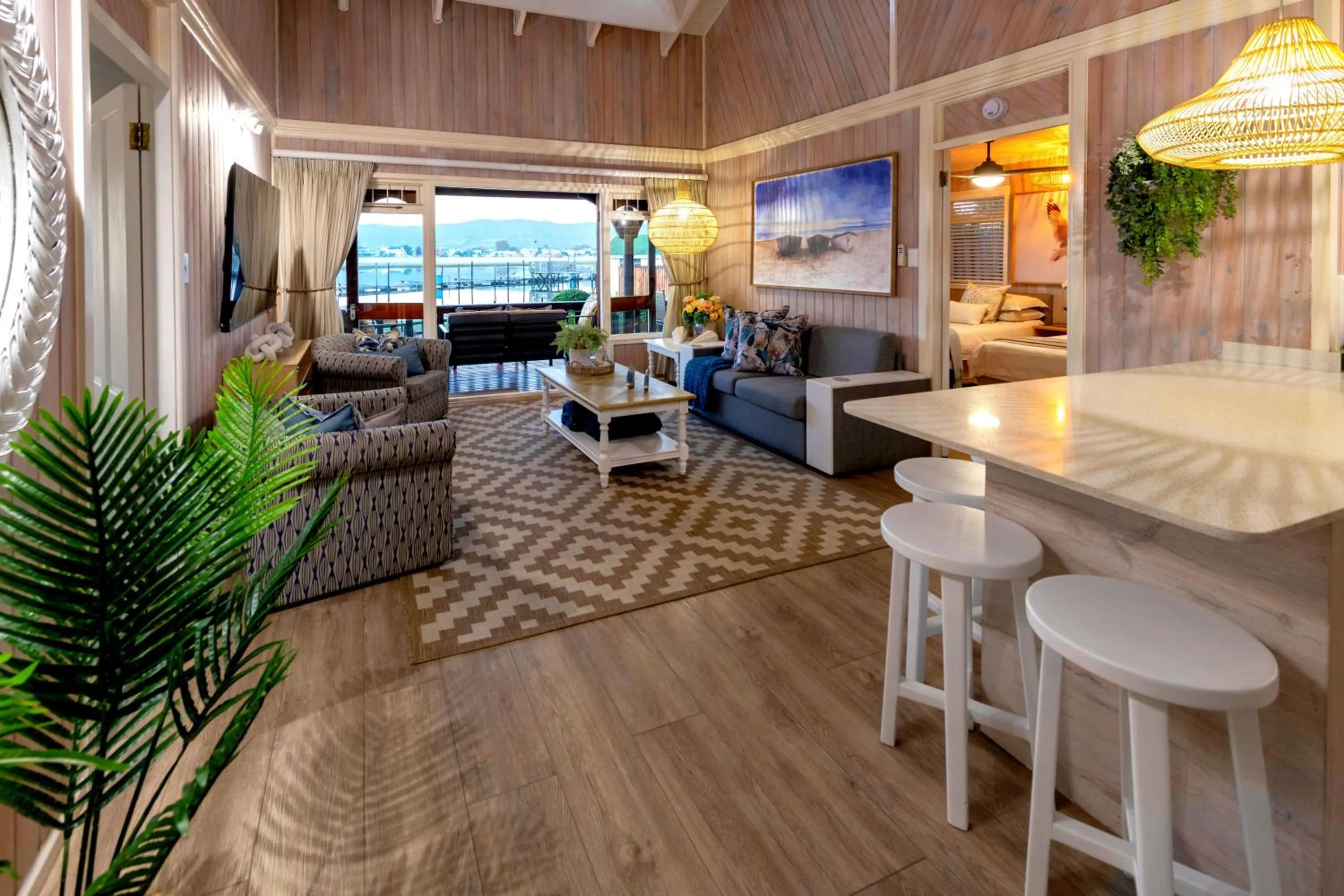 Communal lounge/ TV room in Knysna River Club by First Private Stays