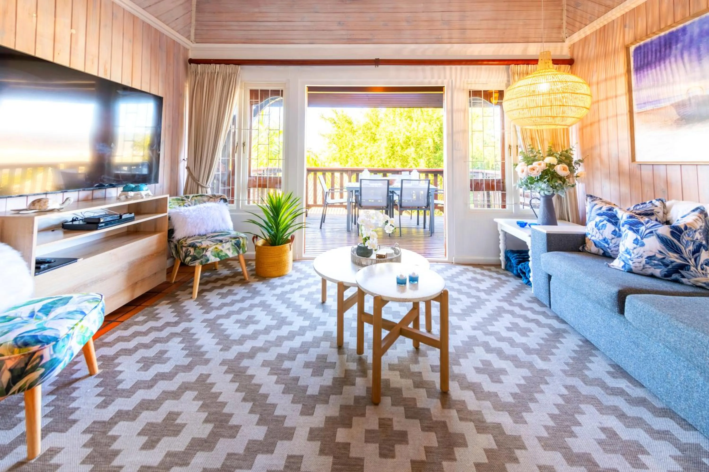 Communal lounge/ TV room in Knysna River Club by First Private Stays