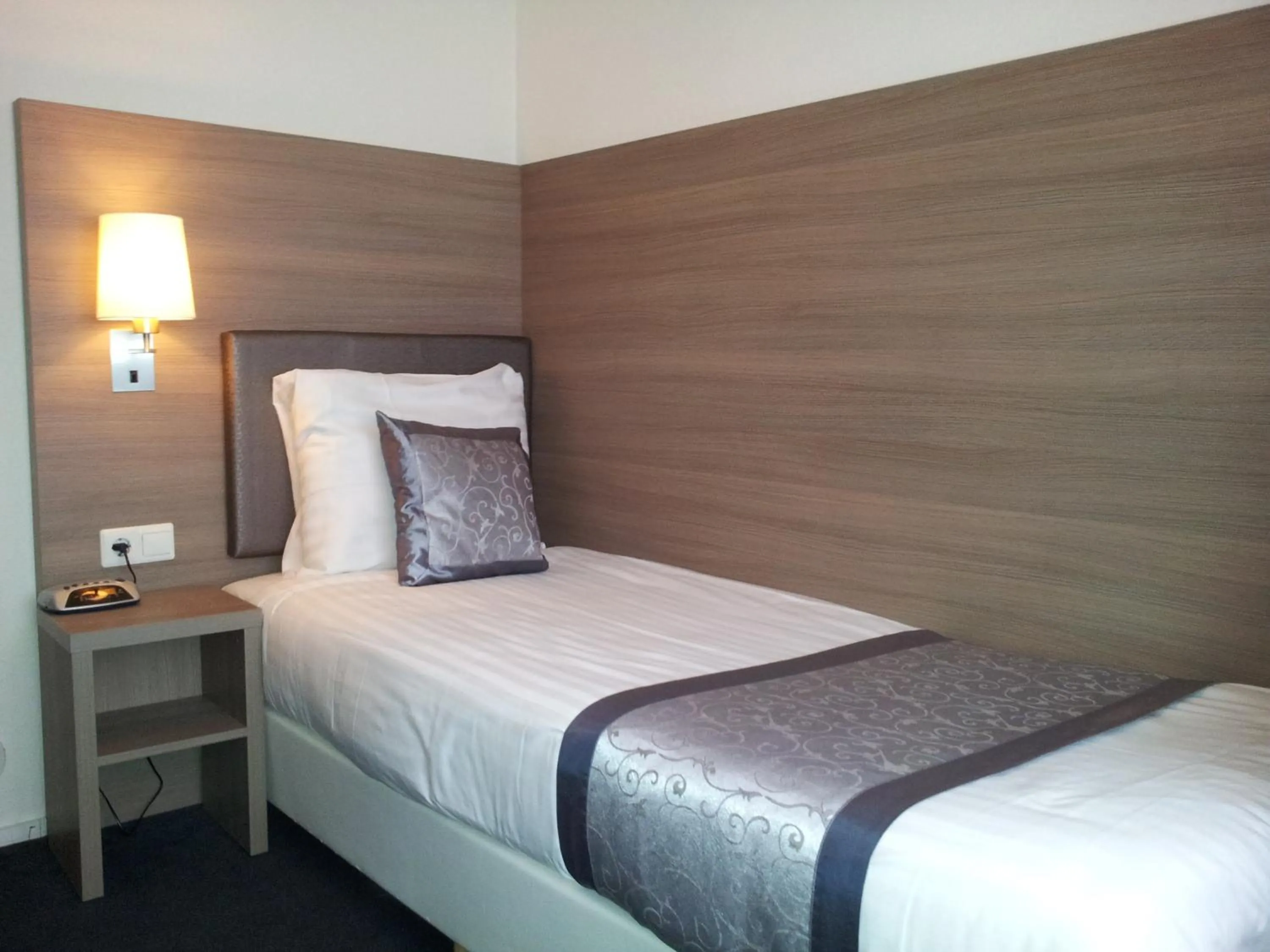 Bed in The Concert Hotel