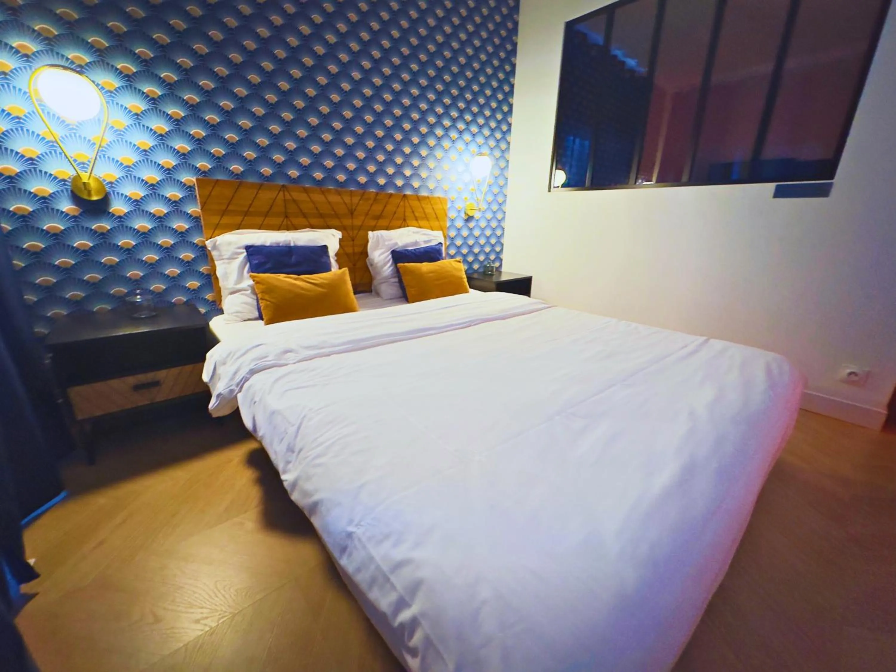 Bed in L'Escale Appartements et Suites en bord de Mer