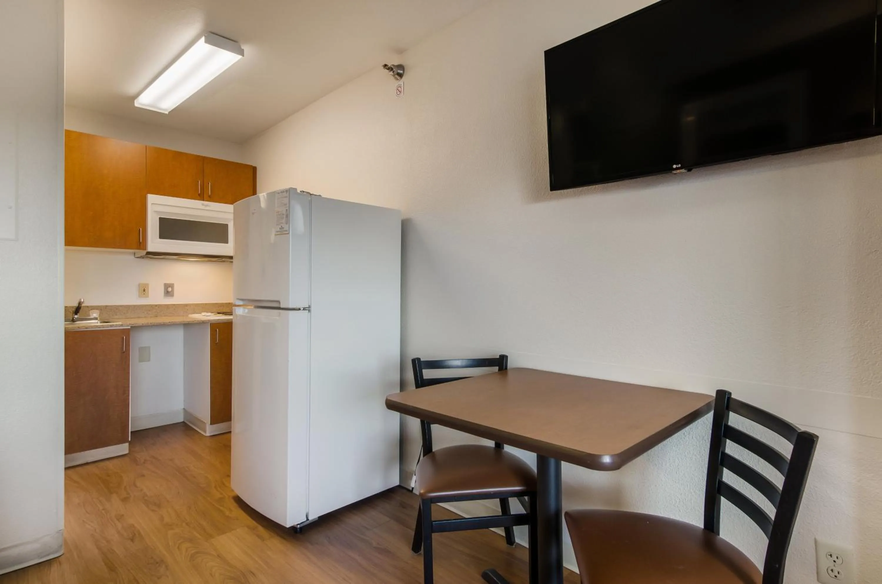 Photo of the whole room in HomeTowne Studios by Red Roof Lake Charles - Sulphur