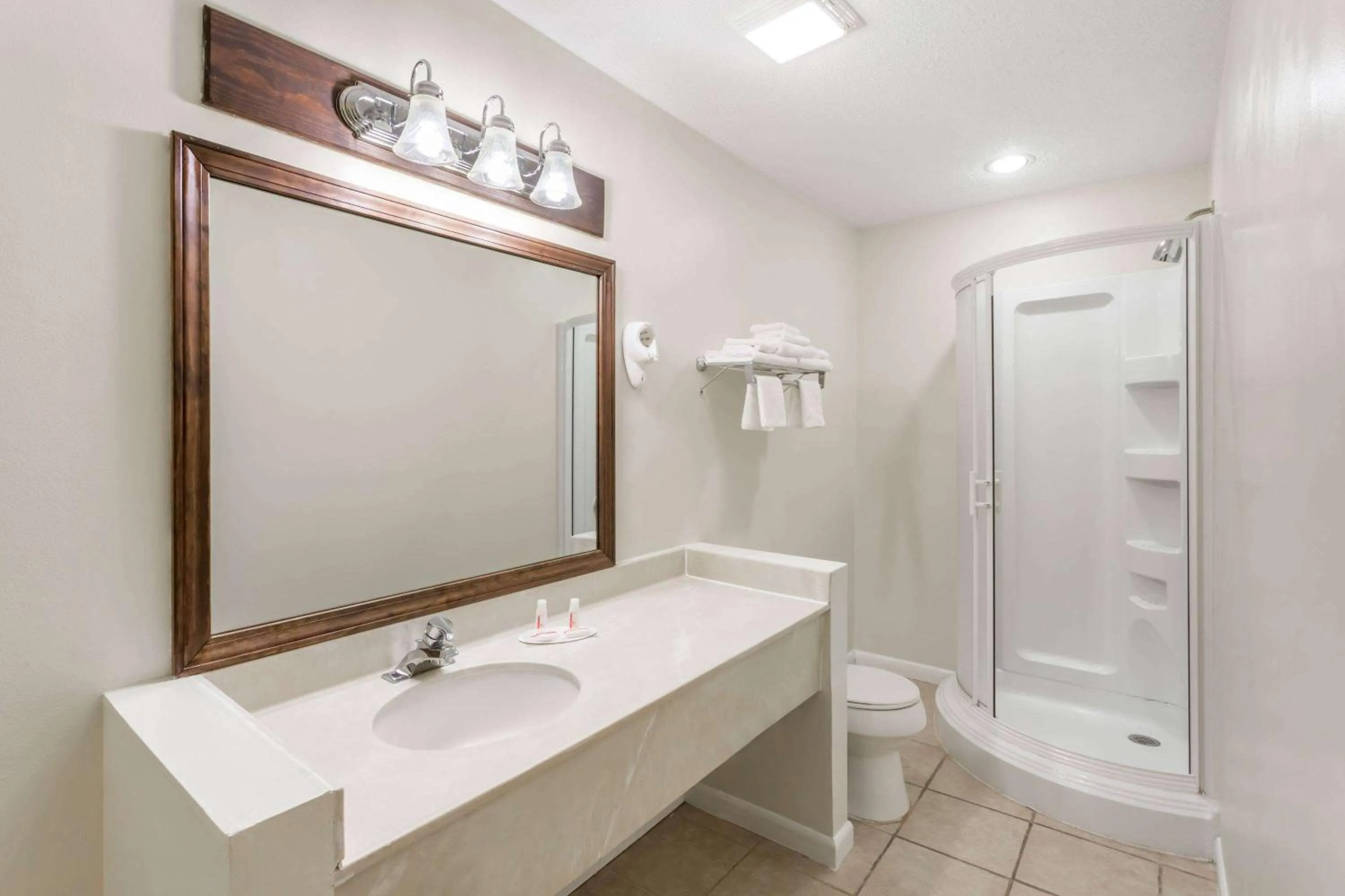 Bathroom in Baymont by Wyndham Greensboro/Coliseum