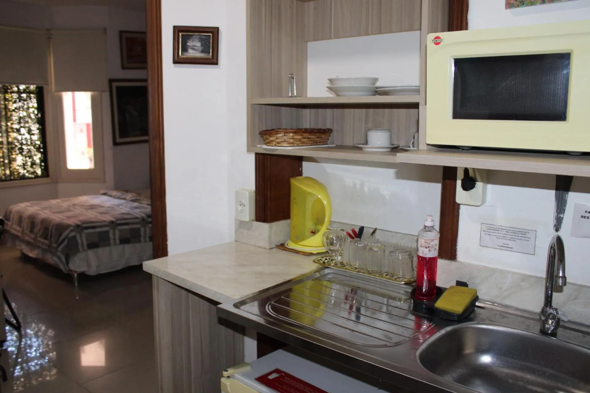 Kitchen or kitchenette, Bed in Aparthotel Maison Suisse