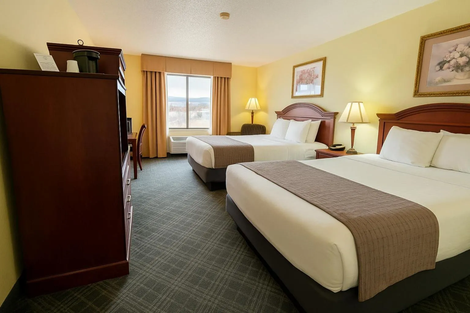 Bed in Stay USA Hotel and Suites