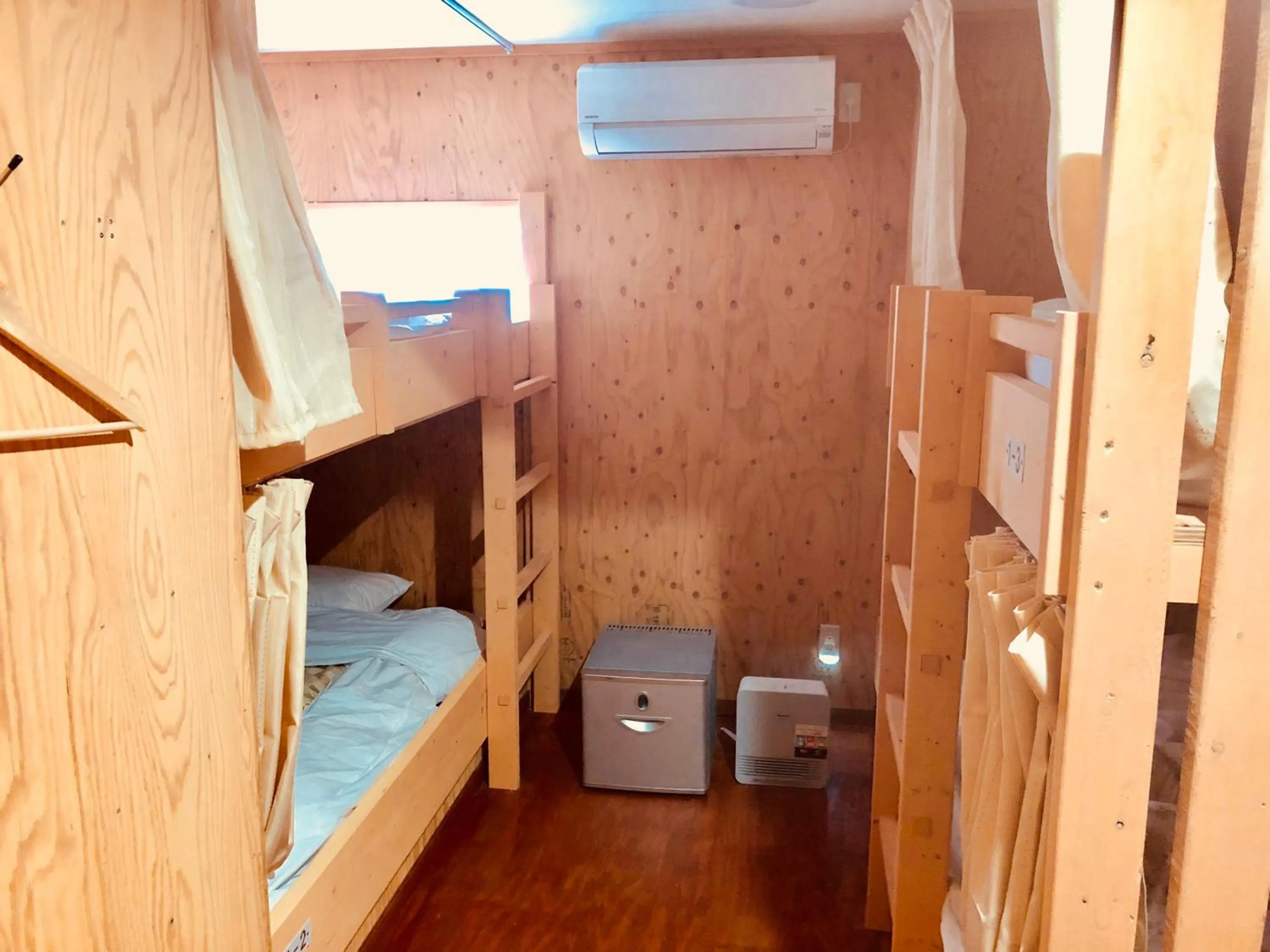 Bed in Guesthouse Otaru Wanokaze