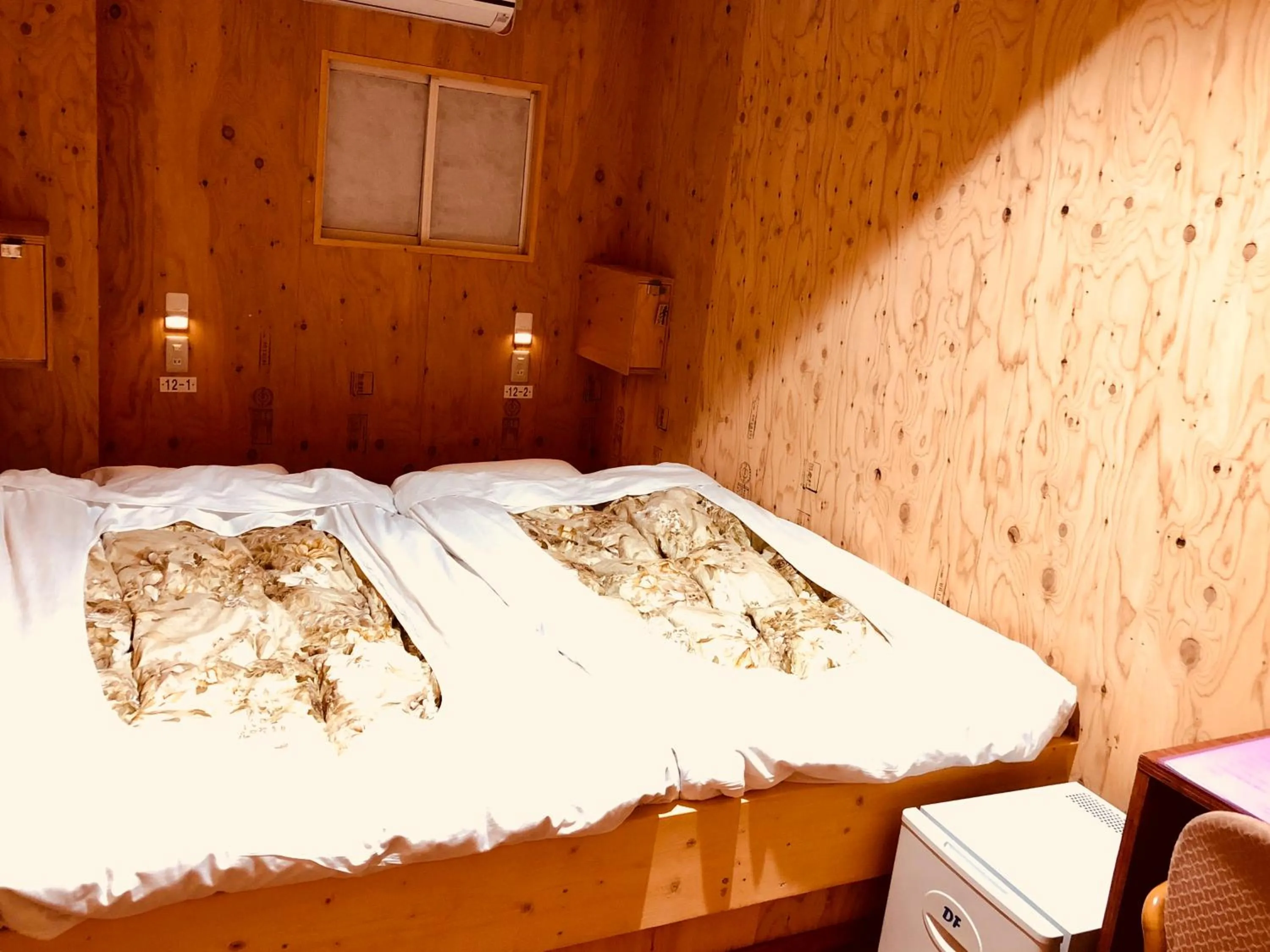 Bed in Guesthouse Otaru Wanokaze