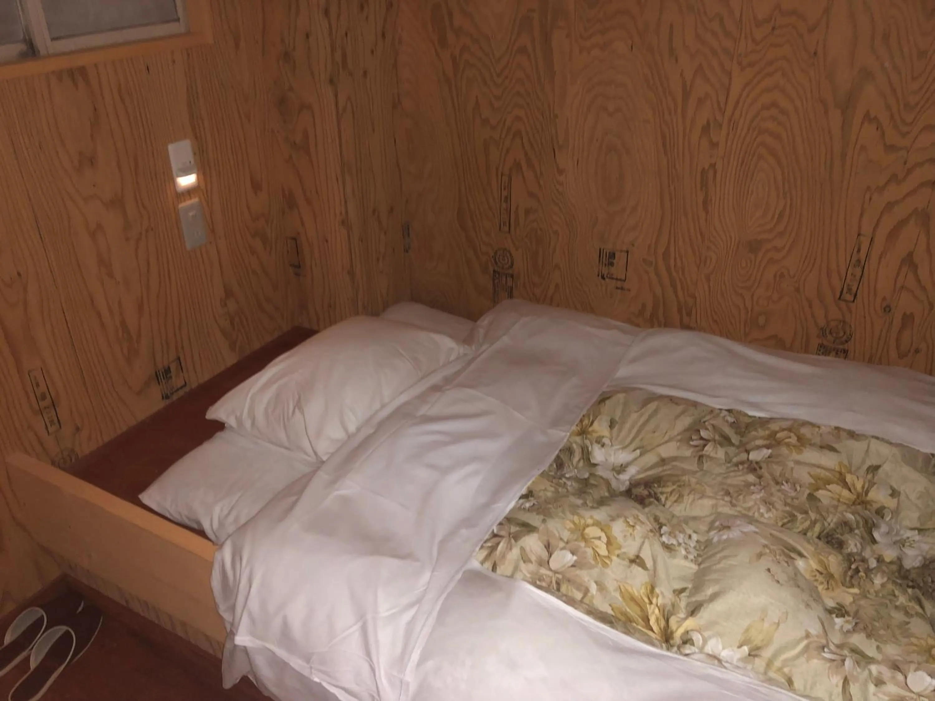 Bed in Guesthouse Otaru Wanokaze
