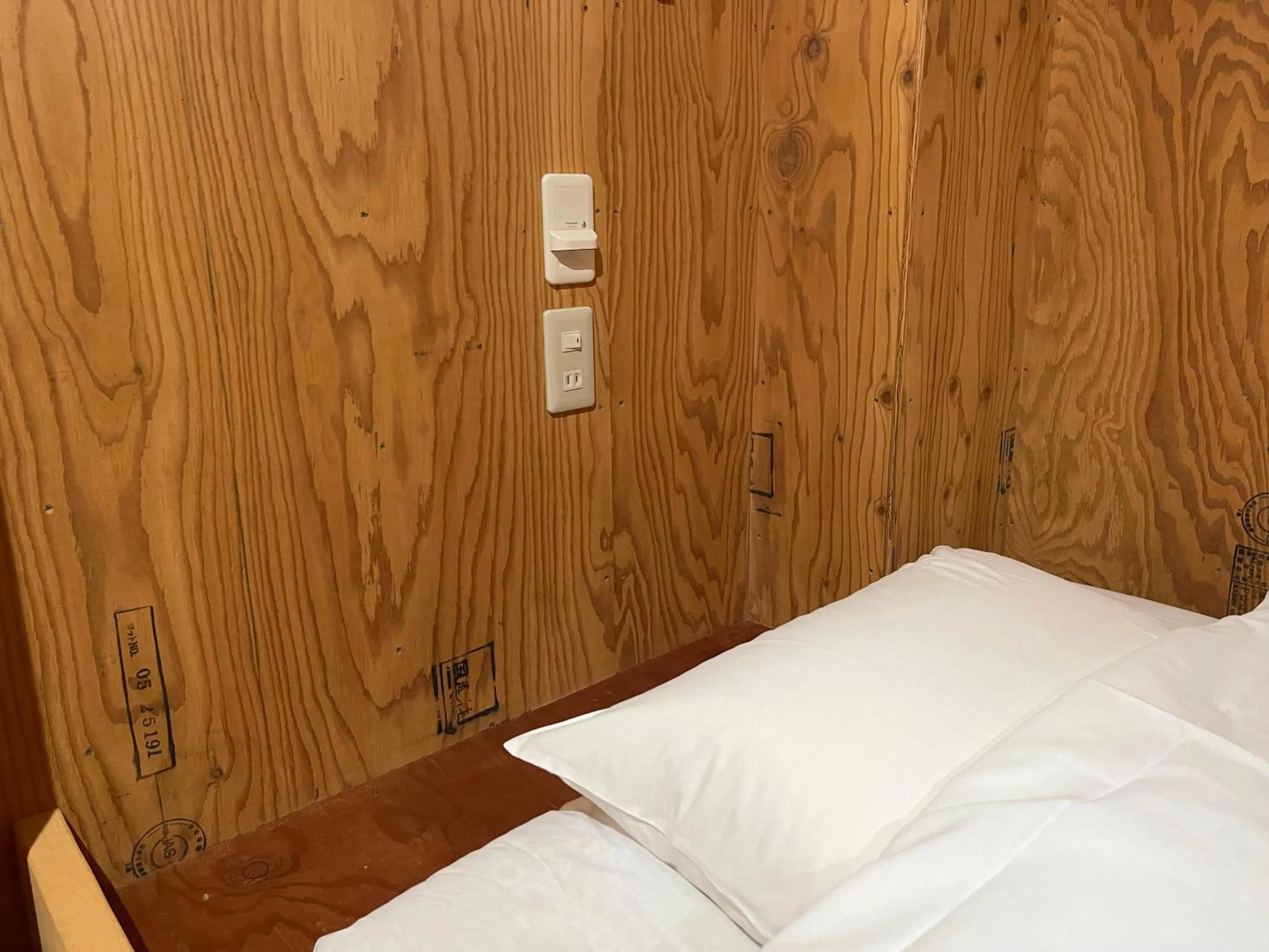 Bed in Guesthouse Otaru Wanokaze