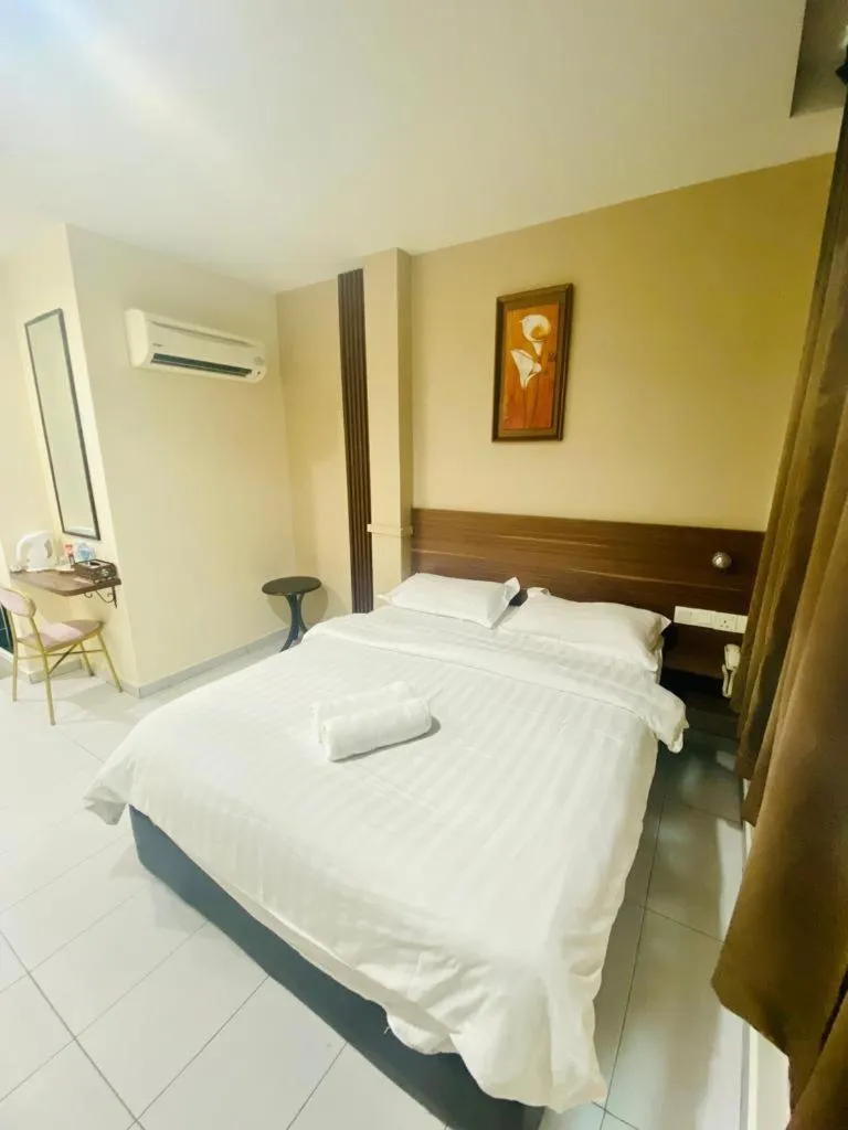 Bed in BG Business Hotel