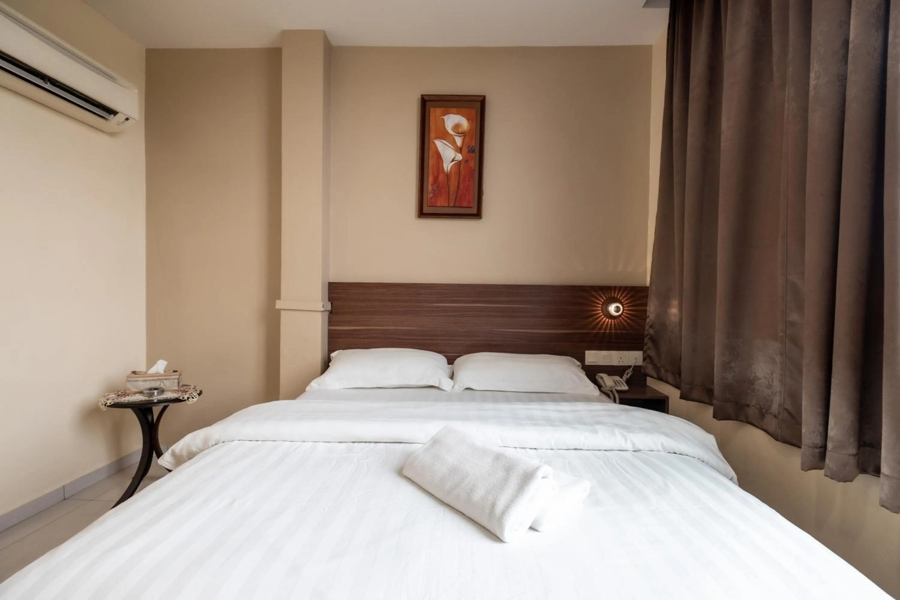 Bed in BG Business Hotel