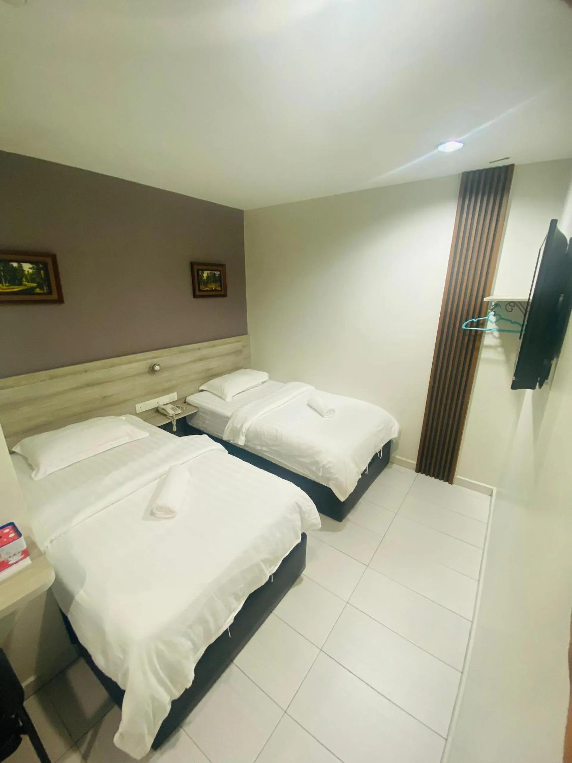 Bed in BG Business Hotel