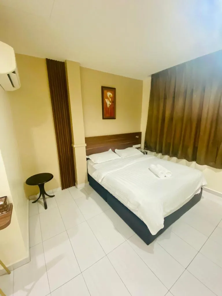 Bed in BG Business Hotel