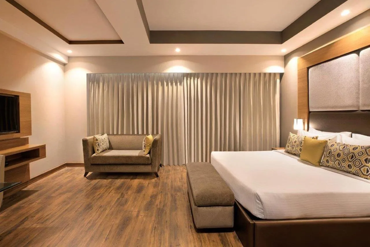 Photo of the whole room, Bed in Lemon Tree Hotel, Sector 68, Sohna Road, Gurugram