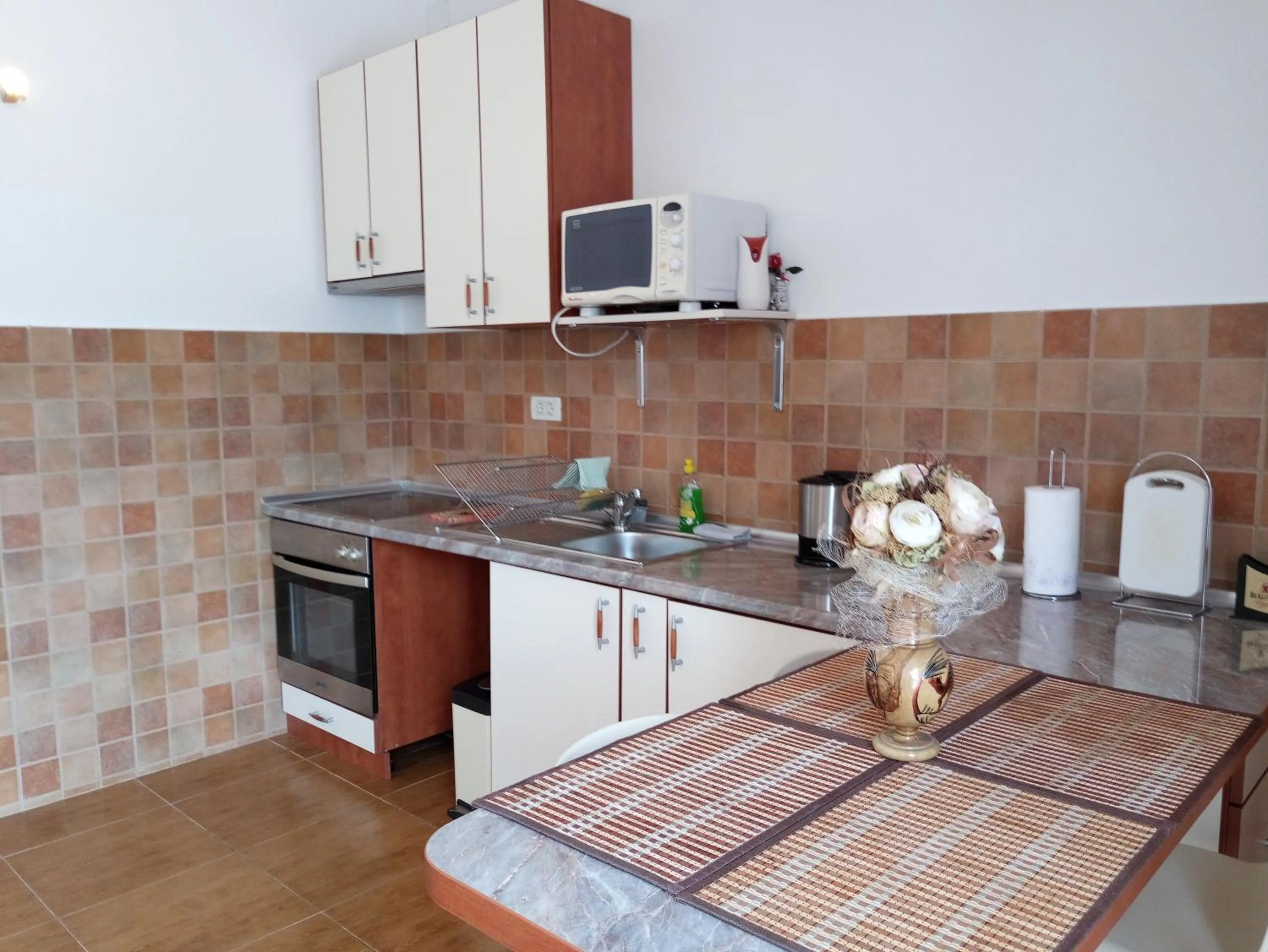 Kitchen or kitchenette in Adria Apartments and Rooms