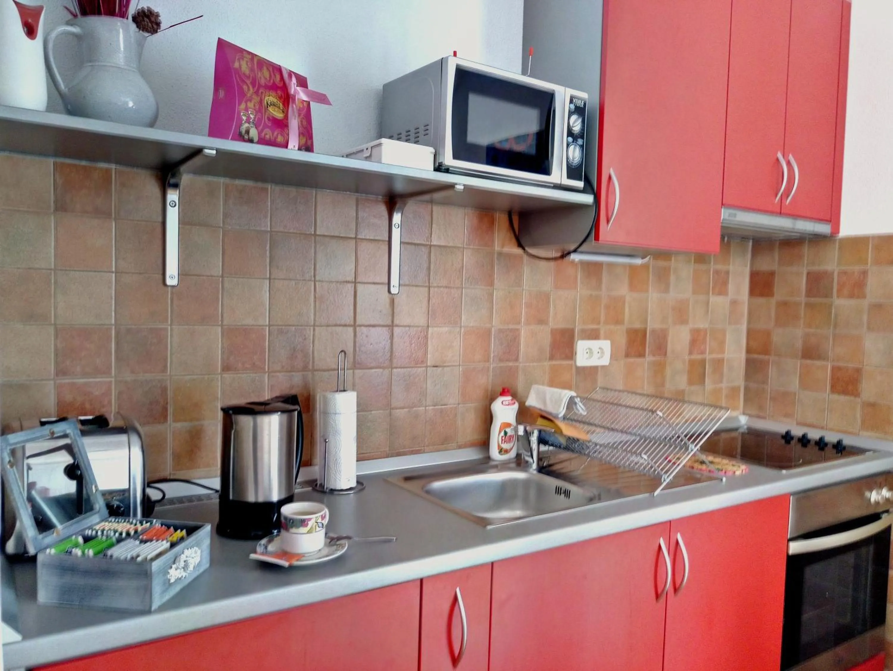 Kitchen or kitchenette in Adria Apartments and Rooms