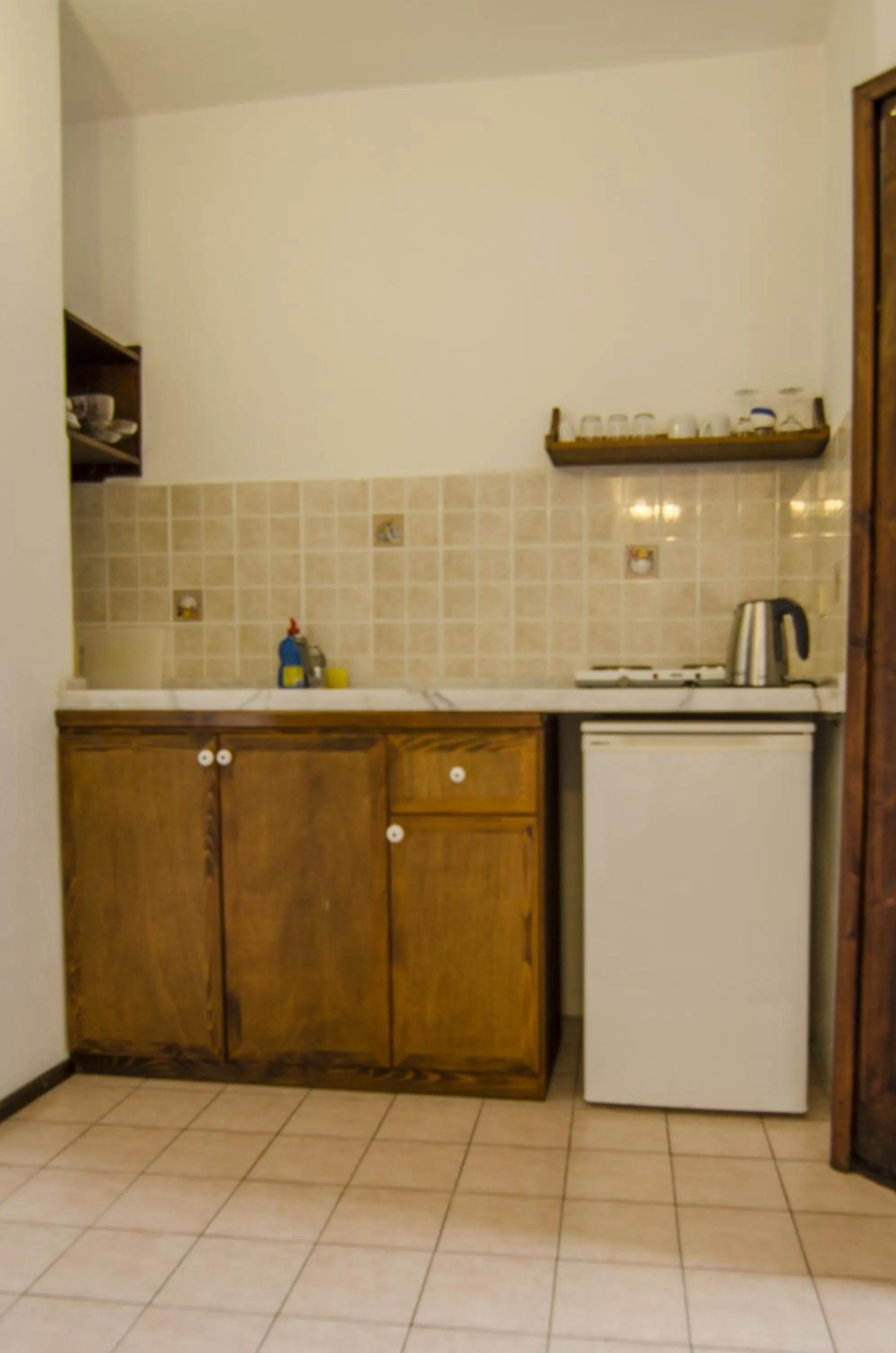 Kitchen or kitchenette in Olive Garden Apart Hotel