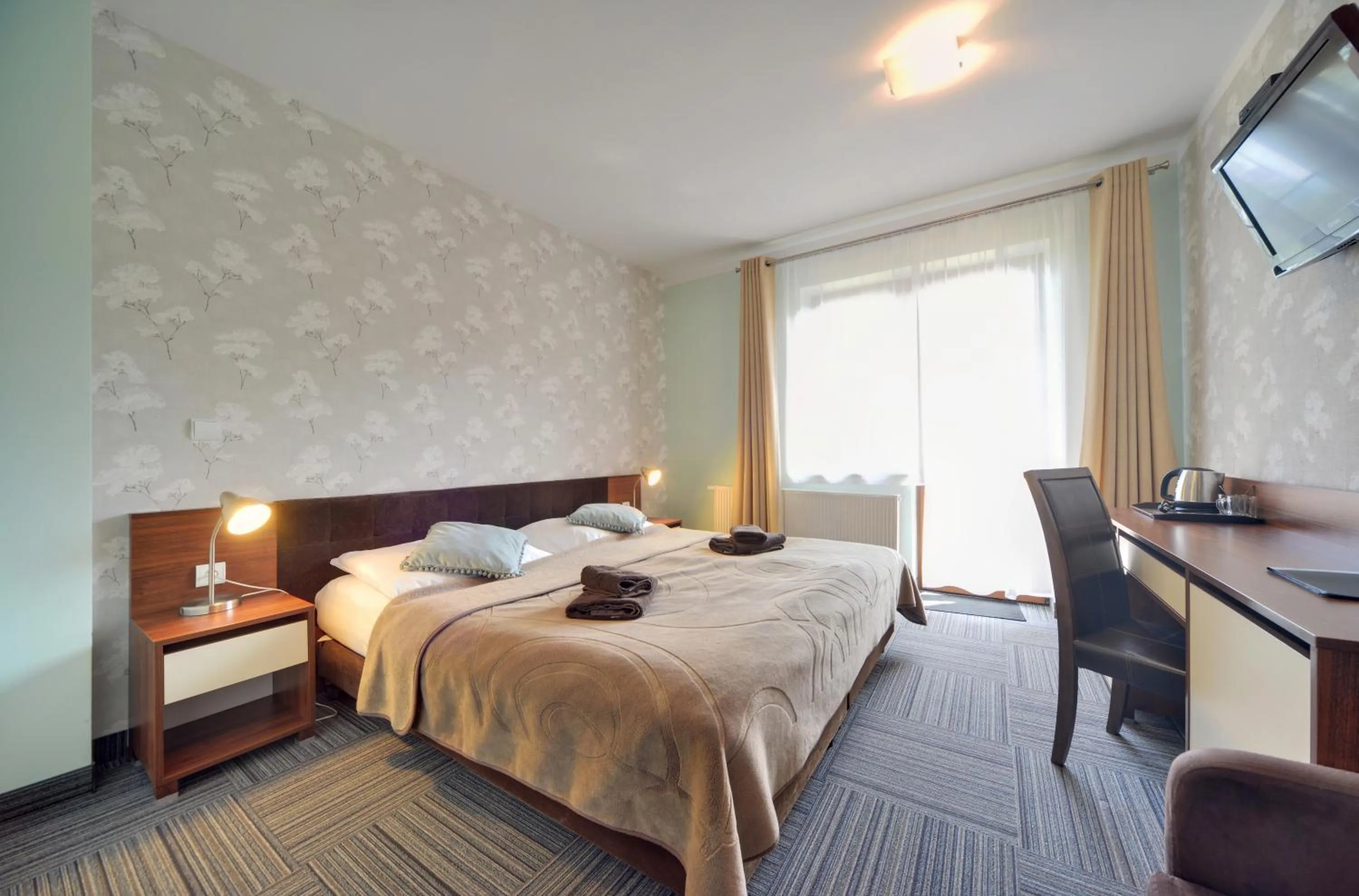 Bed in WILLA PETRUS - CENTRUM BALKONY WINDA ŚNIADANIA RELAKS I WYGODa