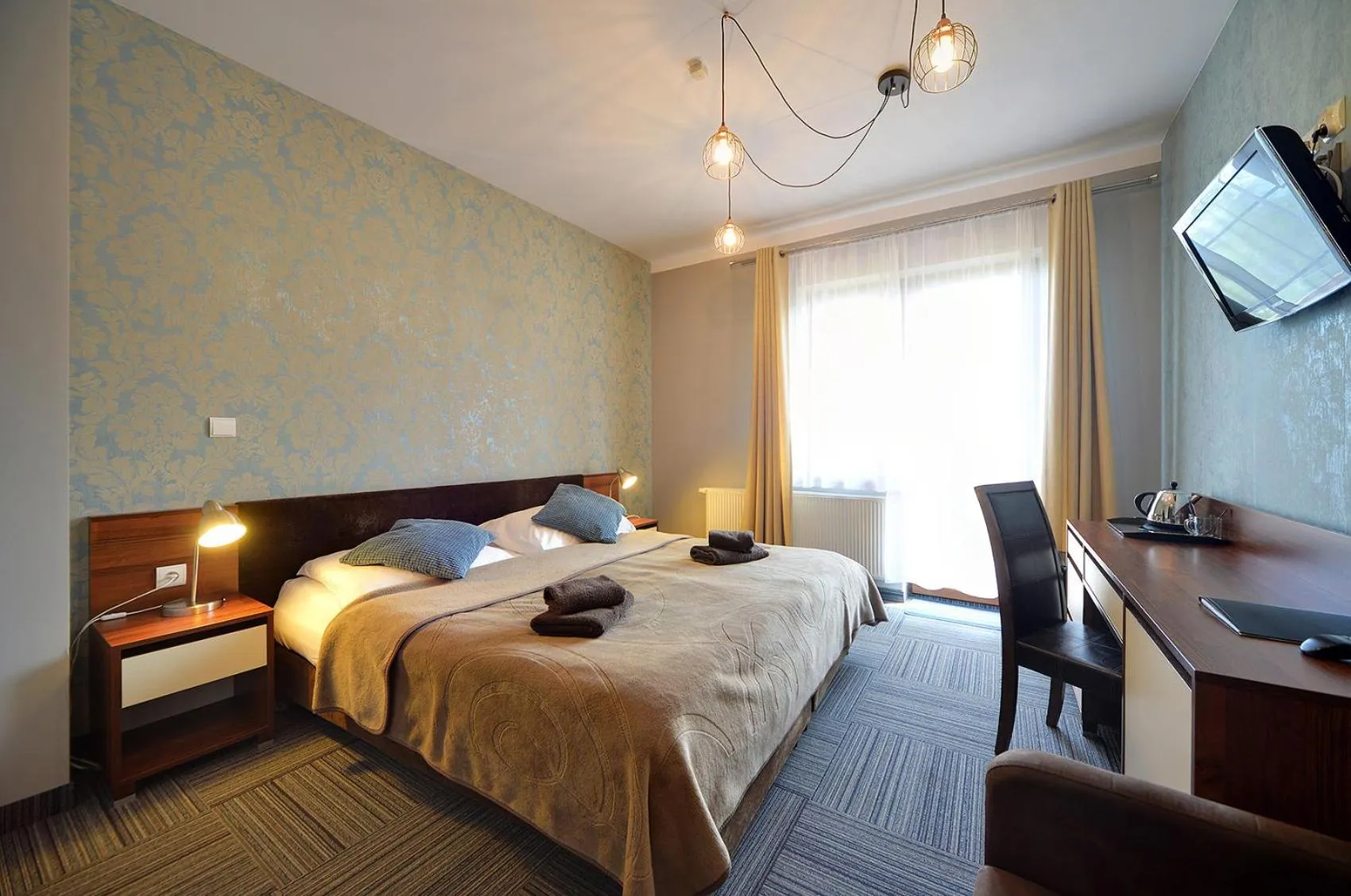 Bed in WILLA PETRUS - CENTRUM BALKONY WINDA ŚNIADANIA RELAKS I WYGODa