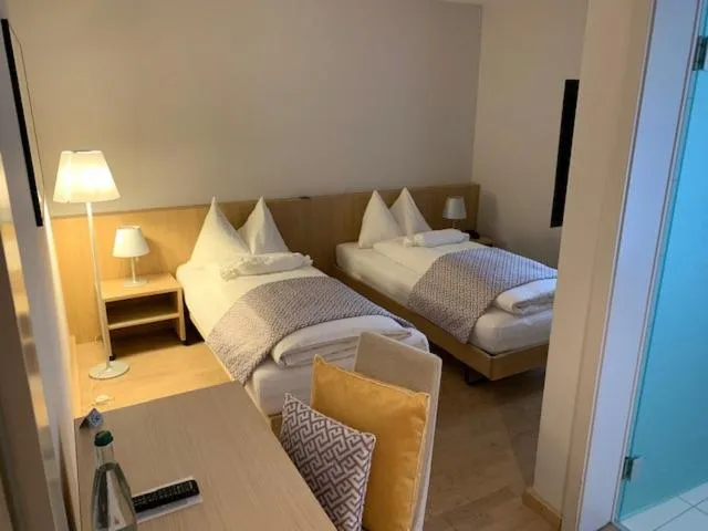 Bed in Hotel Jean-Jacques Rousseau