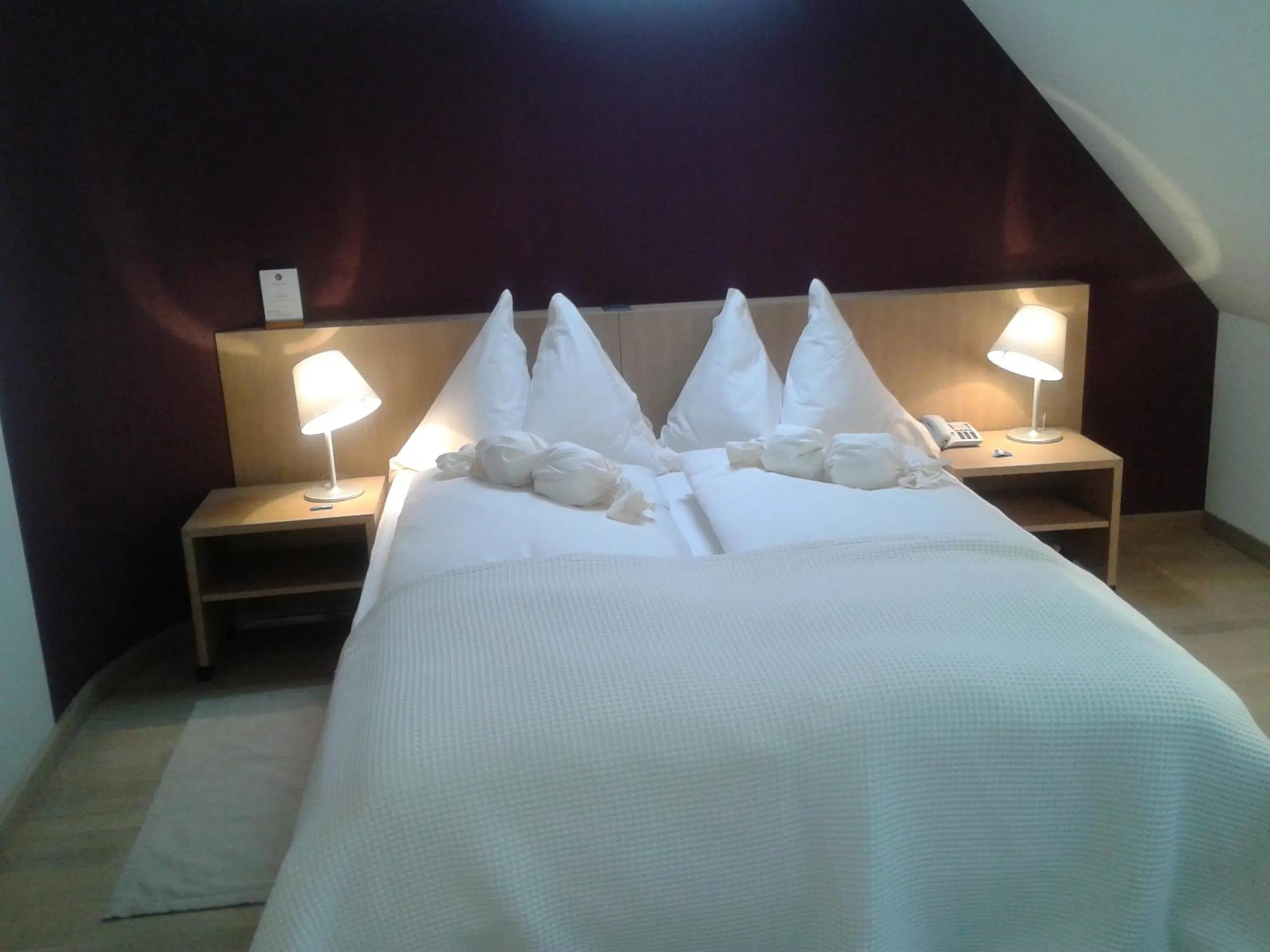 Bed in Hotel Jean-Jacques Rousseau