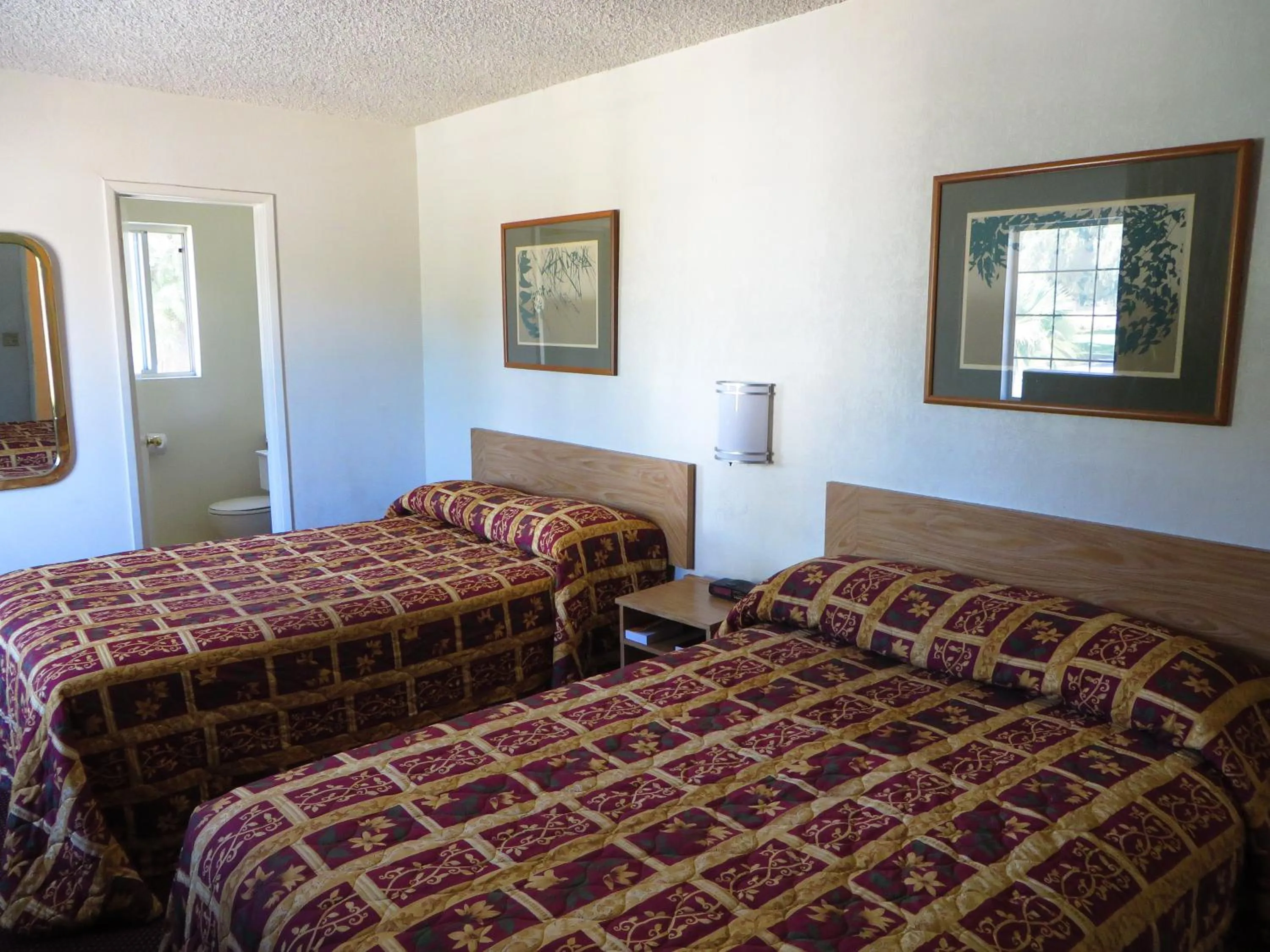 Photo of the whole room, Bed in American Inn
